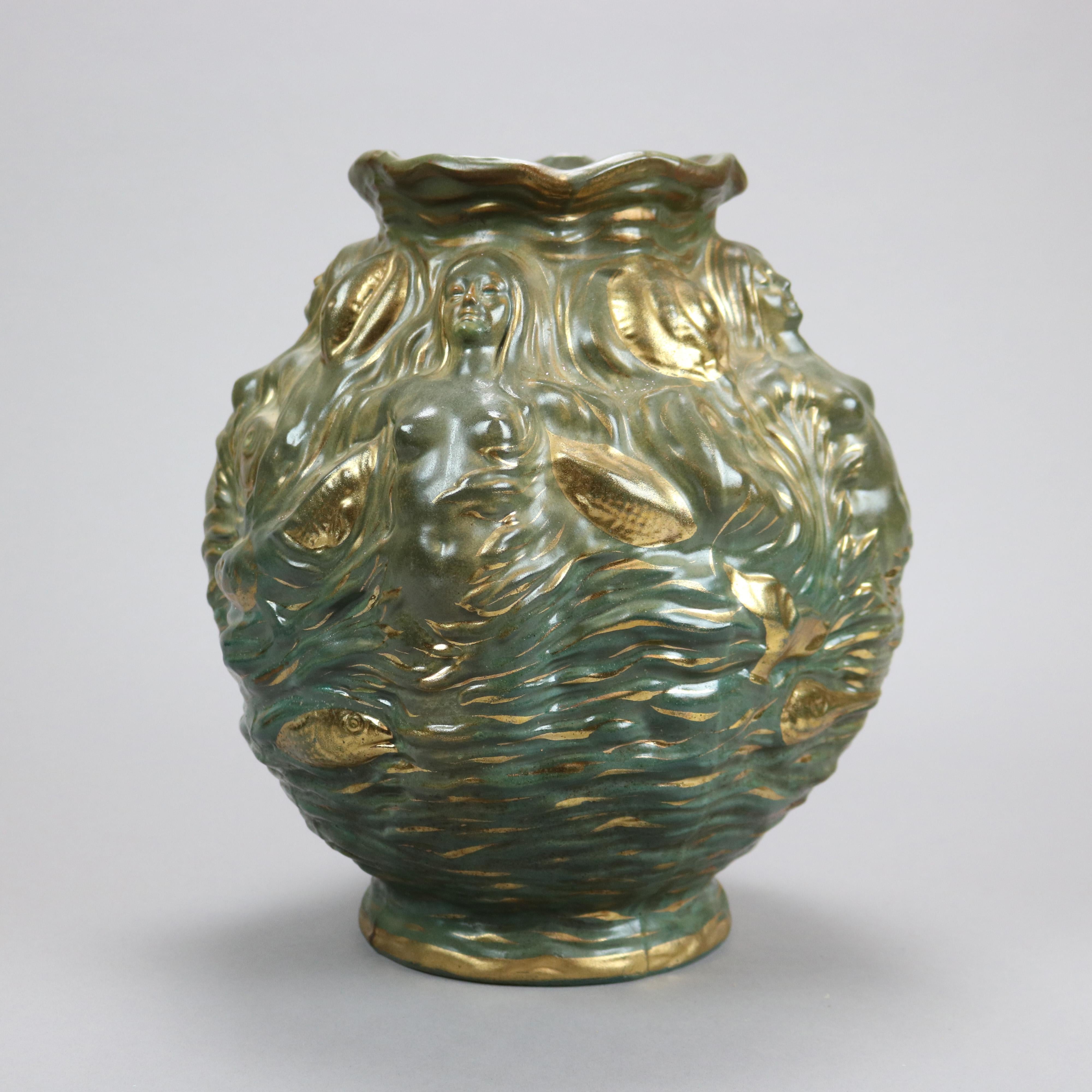 An antique French Art Nouveau vase by Vance Avon offers Faience art pottery construction in bulbous form with female figures and floral elements in relief, glazed with gilt highlights, signed on the base as photographed, c1900

Measures - 12''H X