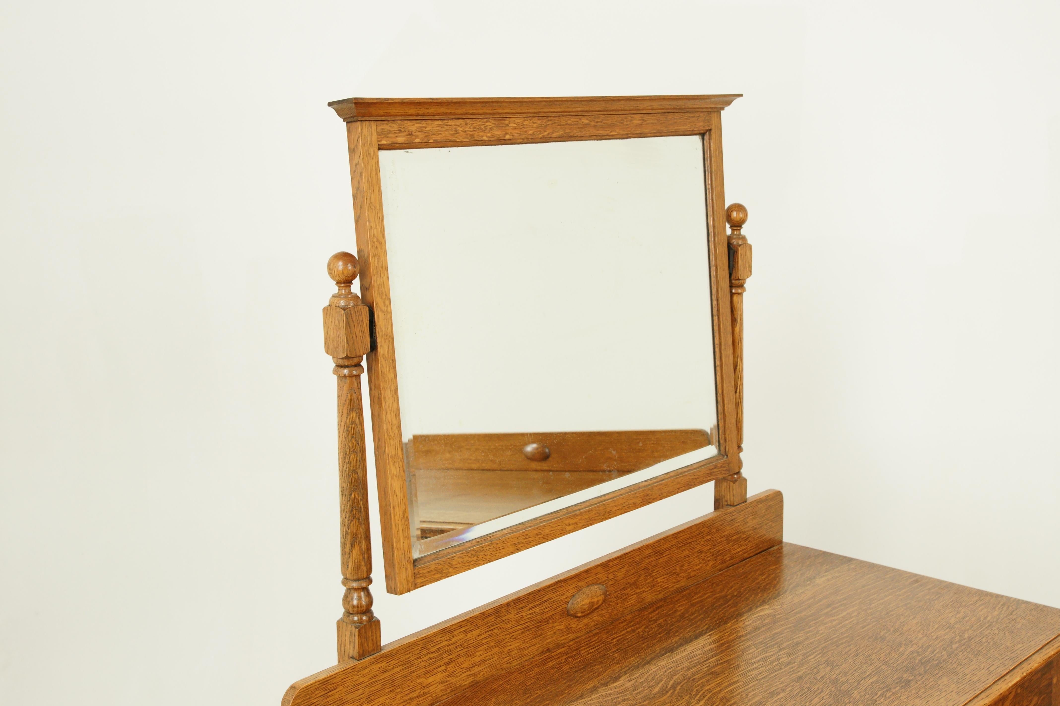 Antique vanity, antique dresser, beveled mirror, tiger oak, Scotland, 1930, antique furniture

Scotland, 1930
Solid oak construction
Recently refinished
Mirror above tilts forward and backwards
Molded top
Below are three-dovetailed drawers with