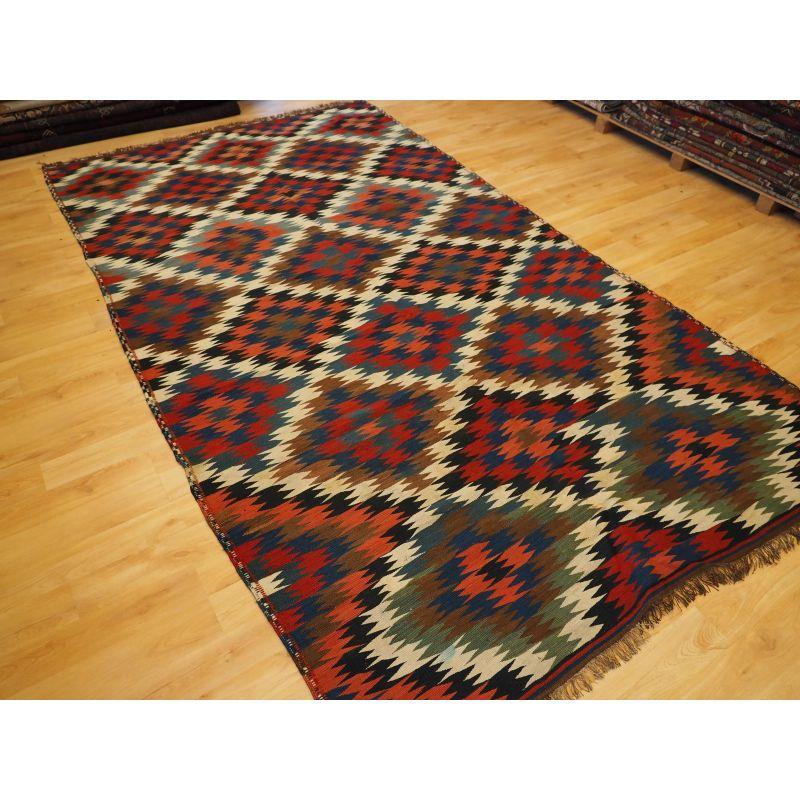 Antique Varamin kilim with excellent natural colours and outstanding bold 'Eye Dazzler' design.

An excellent example of a Varamin kilim with this sought after design.

The kilim is in excellent condition with only very slight wear.

The kilim has