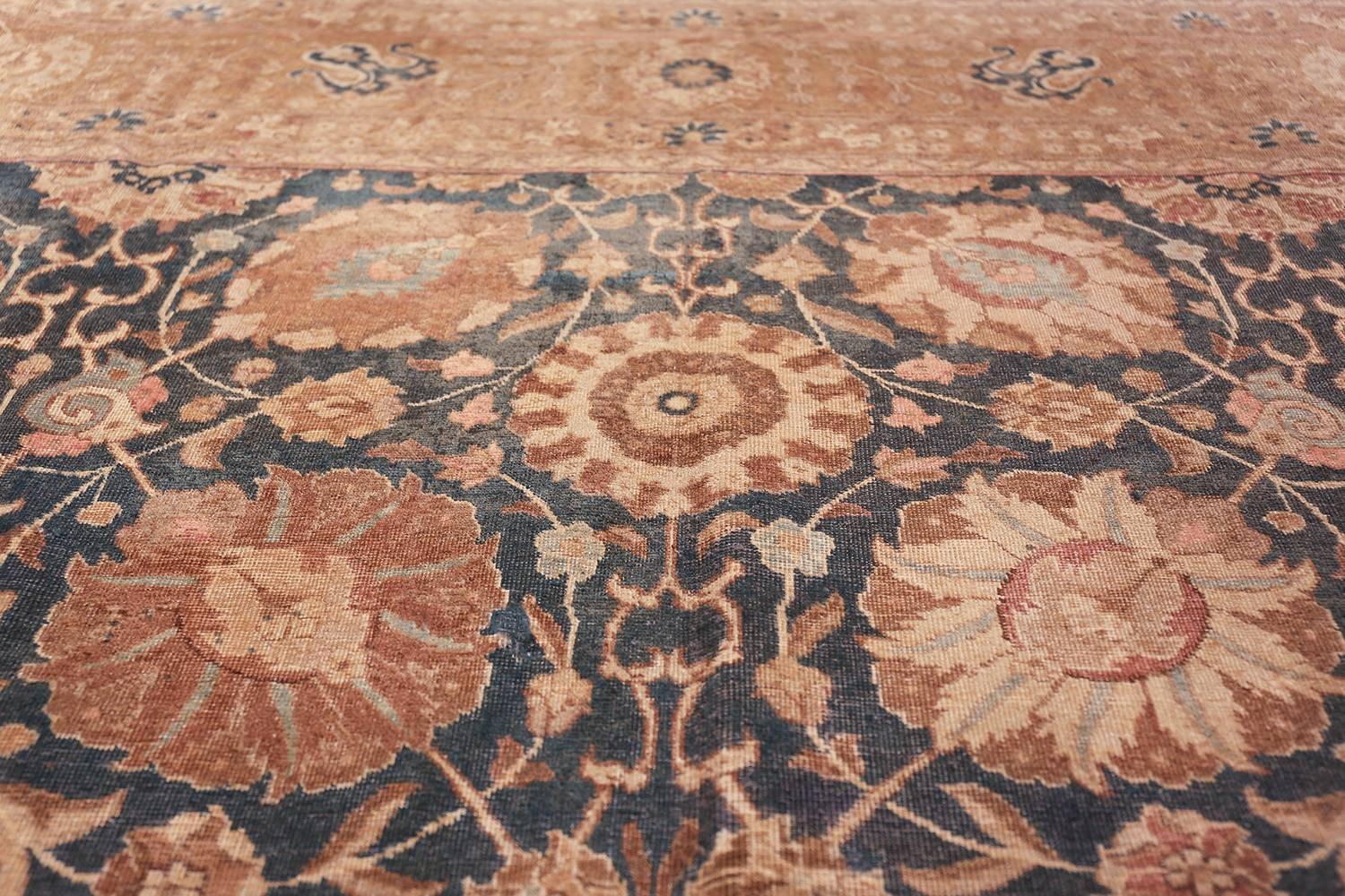 Antique Tabriz rugs are distinguished by their excellent weave and by their remarkable adherence to the classical traditions of antique Persian rug design. But they cannot be distinguished by any particular pattern or by their coloration. The city