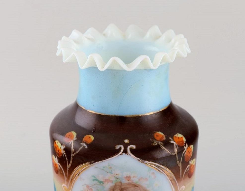 Antique vase in mouth-blown opal art glass with hand-painted motif of young woman and strawberries,
circa 1900.
Measures: 26.5 x 14 cm.
In excellent condition.