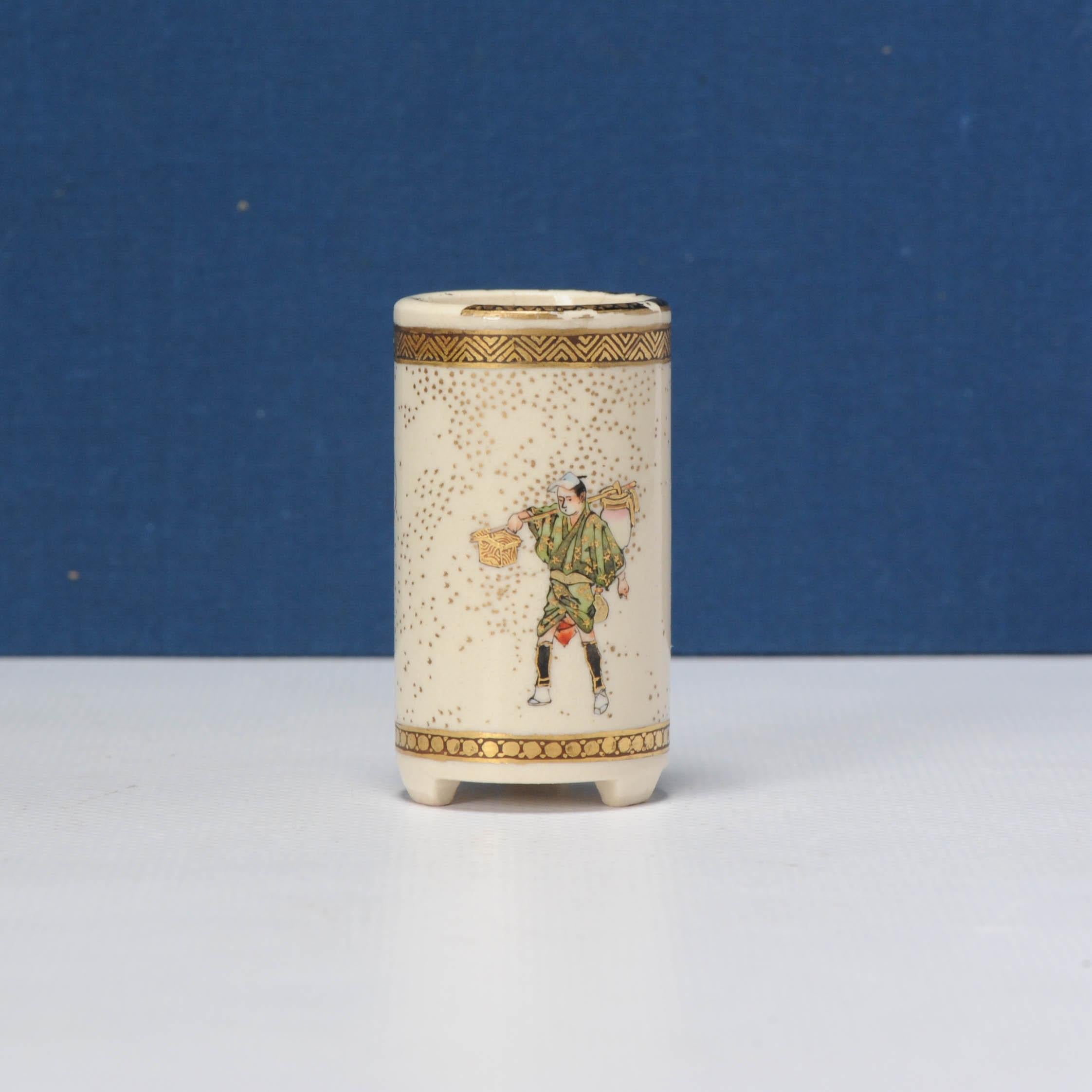 Cylindrical vase with a continuous scene of a group of travellers and couriers, one stooping to tie his laces, signed Kinkozan.

Additional information:
Material: Porcelain & Pottery
Japanese Style: Satsuma
Region of Origin: Japan
Period: 19th
