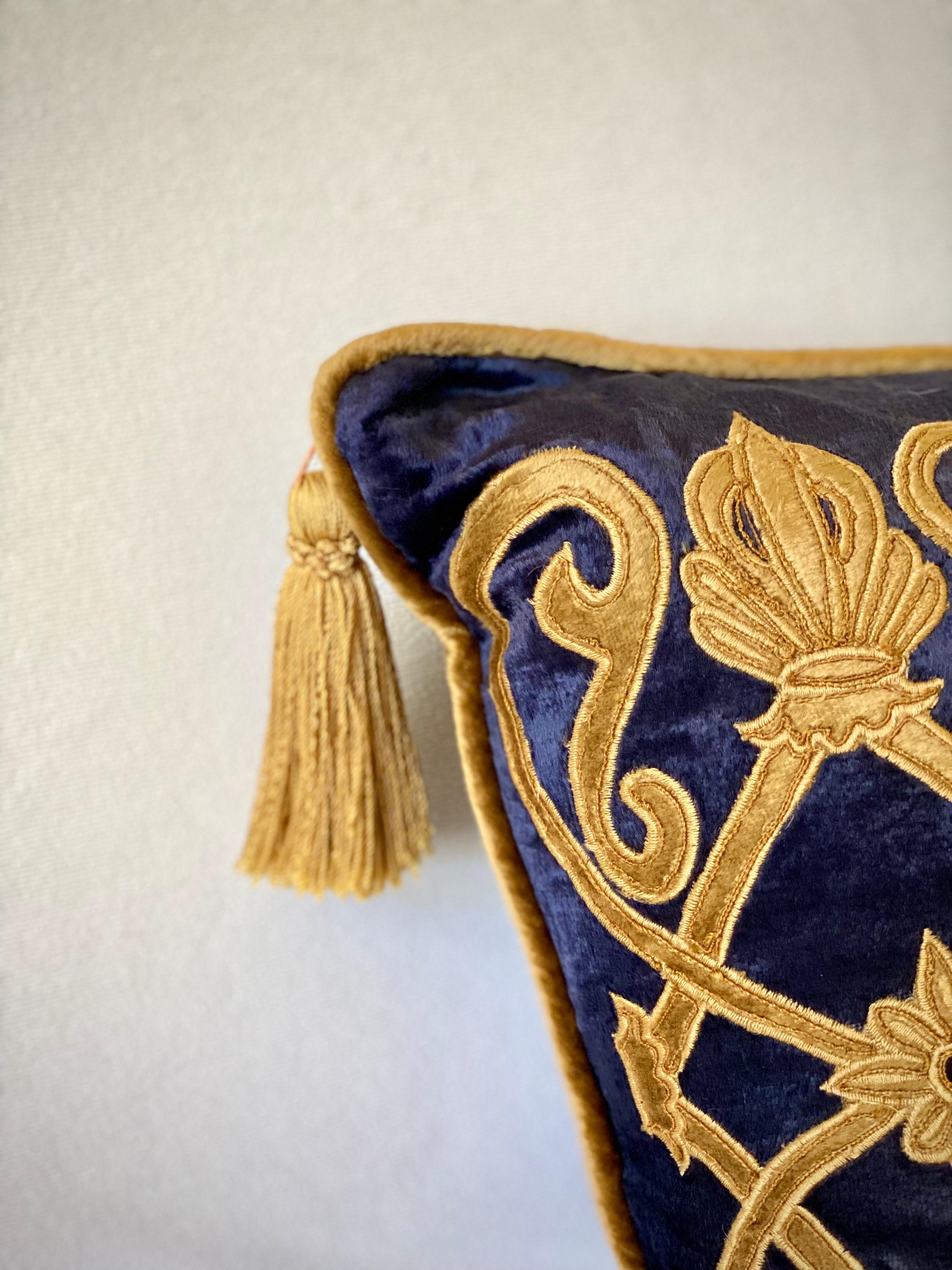 Luxury cushion 
Blue antique velvet with gold velvet applique. Gold welt and tassel
zipper closure, down/feather fill.
 