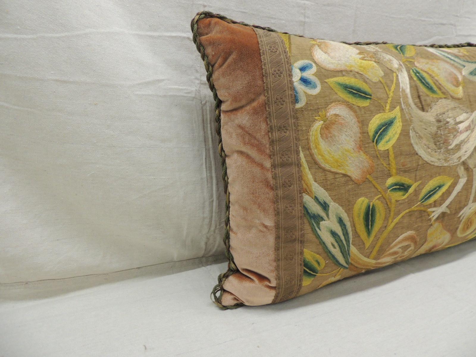 Antique Venetian floral embroidered large bolster decorative pillow.
Italian floral silk floss thread embroidered on linen depicting large bird and fruits.
In shades of yellow, green, white, pink and blue.
Darkish copper color silk velvet backing