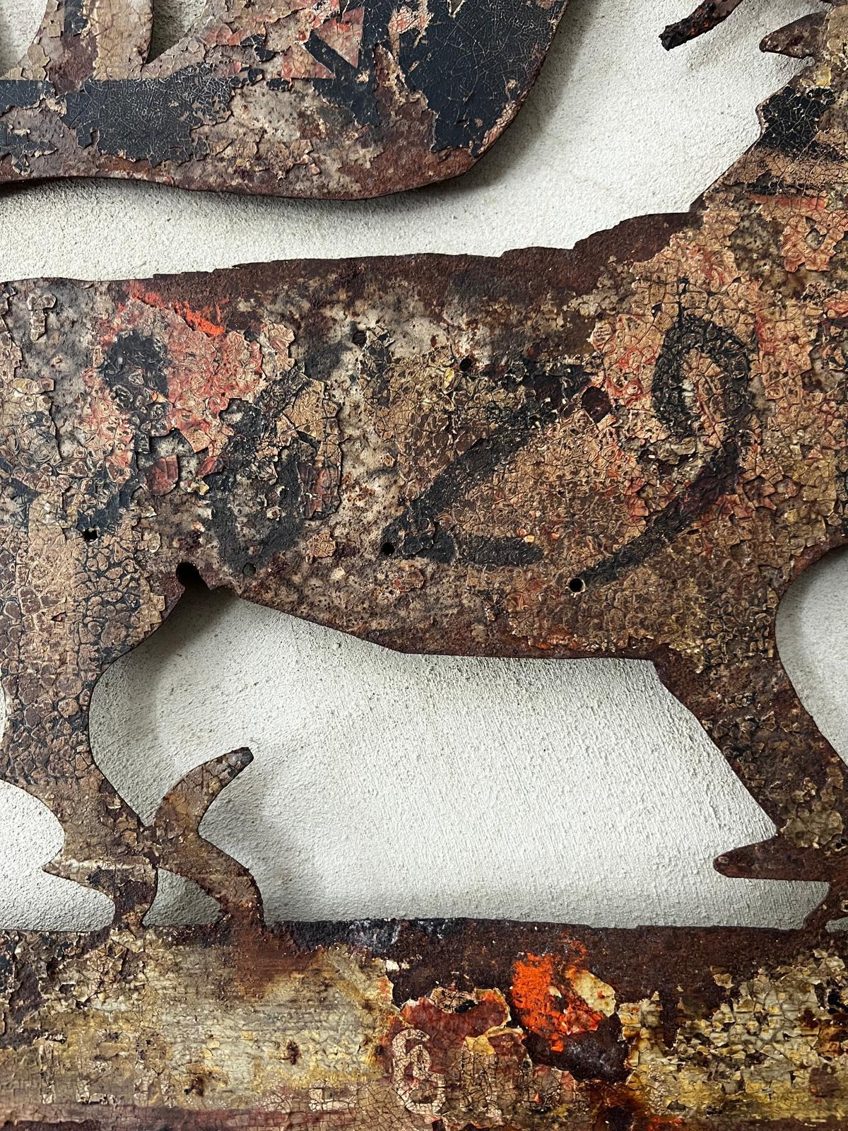 A rare and evocative Venetian iron hanging sign, intricately cut in the form of a stylised dragon within a rectangular frame. This piece is dated 1629, the year of the Venetian Plague, and would originally have been mounted on the exterior of a