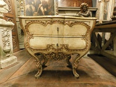 Antique Venetian lacquered and gilded chest of drawers, richly carved, Italy