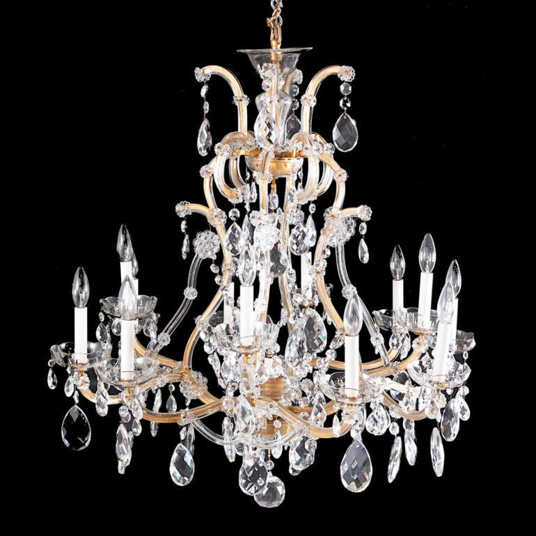 Antique Venetian Maria Theresa crystal chandelier from 1920 made in Italy. Loaded with large hand cut led crystals and draped on crystal cladding. Hanging from the bottom is a large multi faceted 3