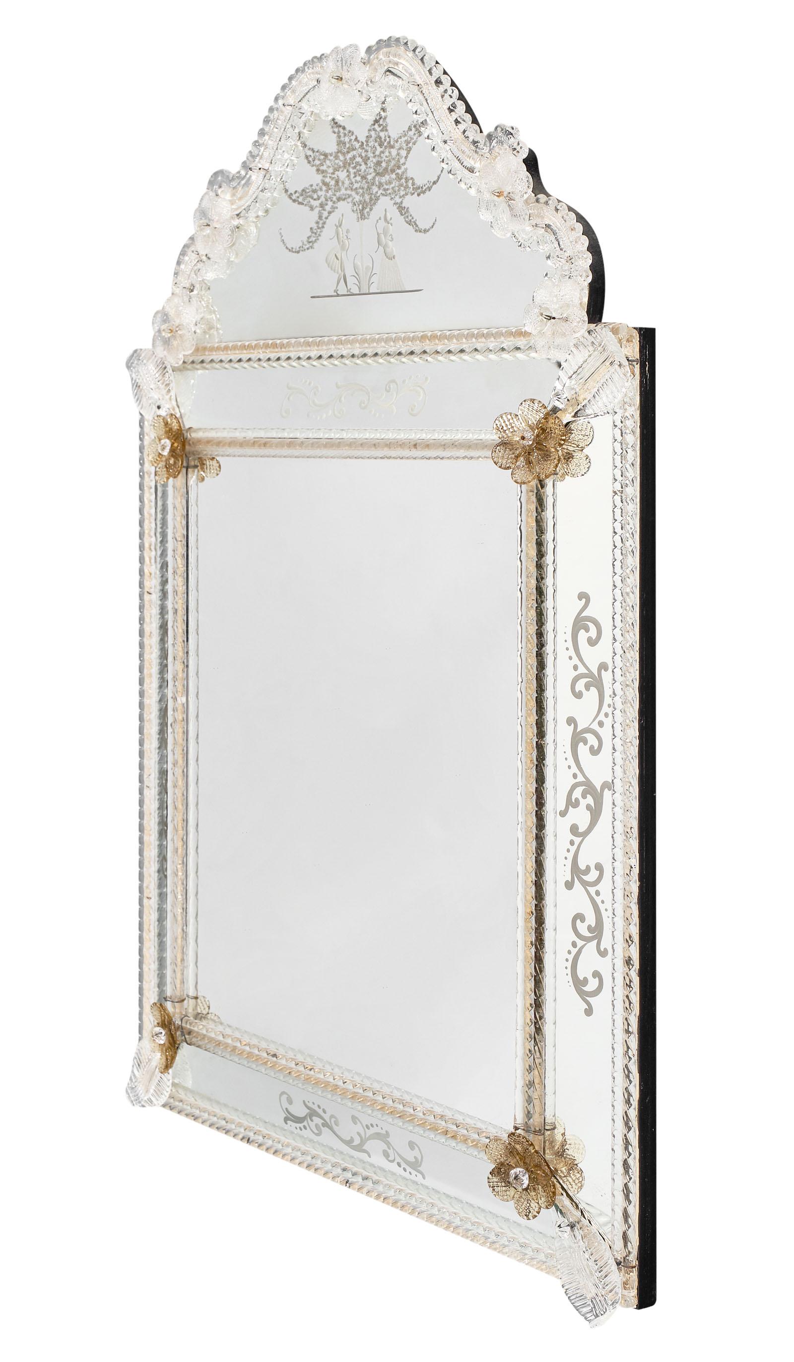 Antique Venetian mirror with pieces of compartmental mirrors chiseled with floral decor. A romantic scene can be found on the fronton. We love the detail of this striking and lovely piece.