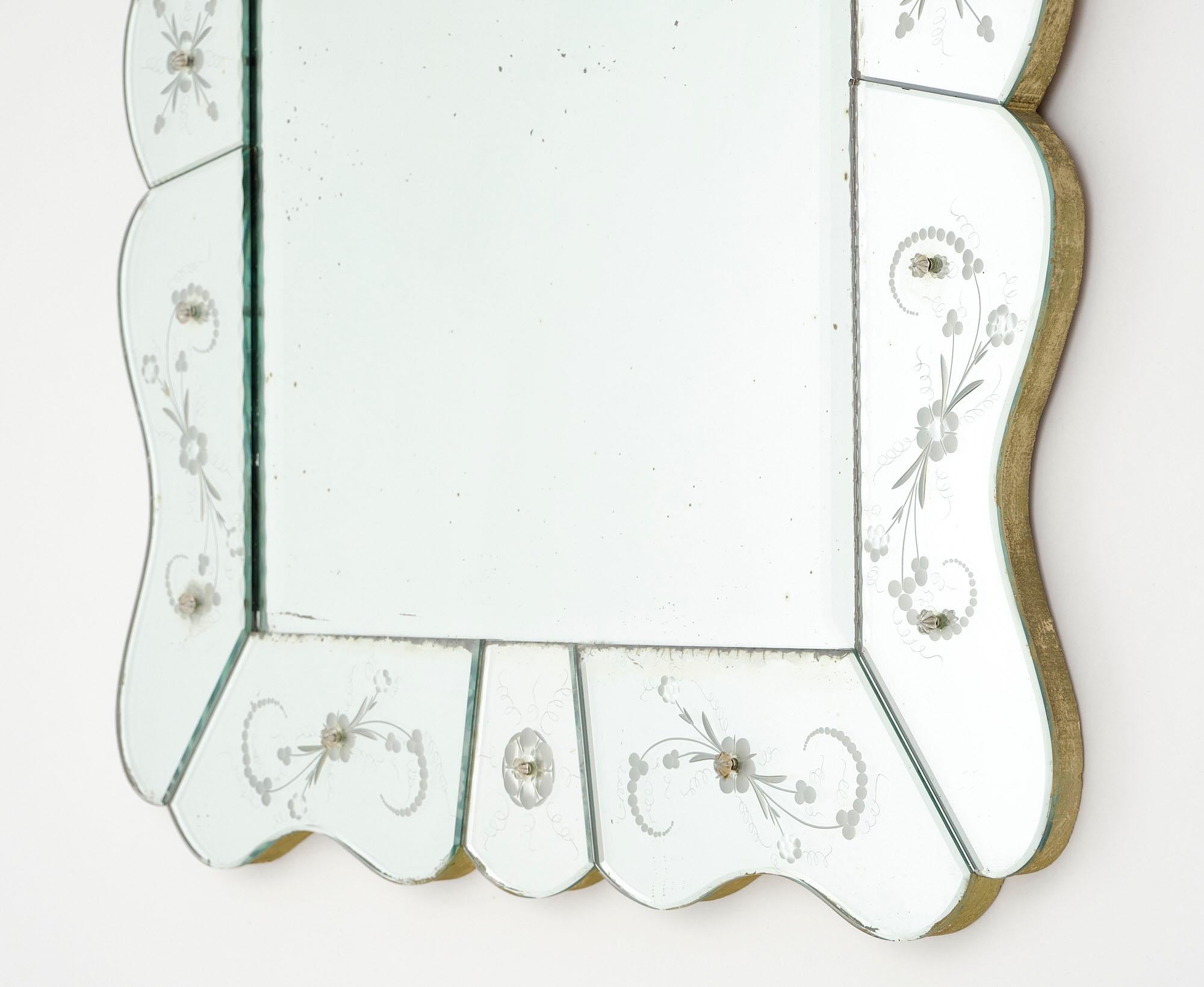 Mirror, Venetian, with beautifully engraved floral details on the glass border. The central rectangular mirror is original. We love the curved lines and elegant Venetian craftsmanship.