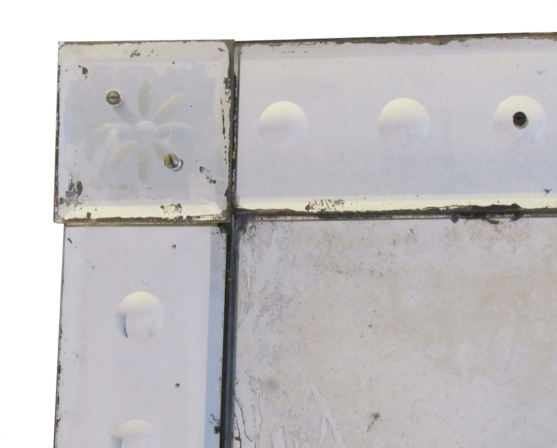 Antique Venetian mirror with bubble detail, simple etched floral motif and mercury foxed centre plate .
This period Venetian mirror dates to Circa 1890 and has a timeless quality which combines effortlessly in both antique and contemporary interiors