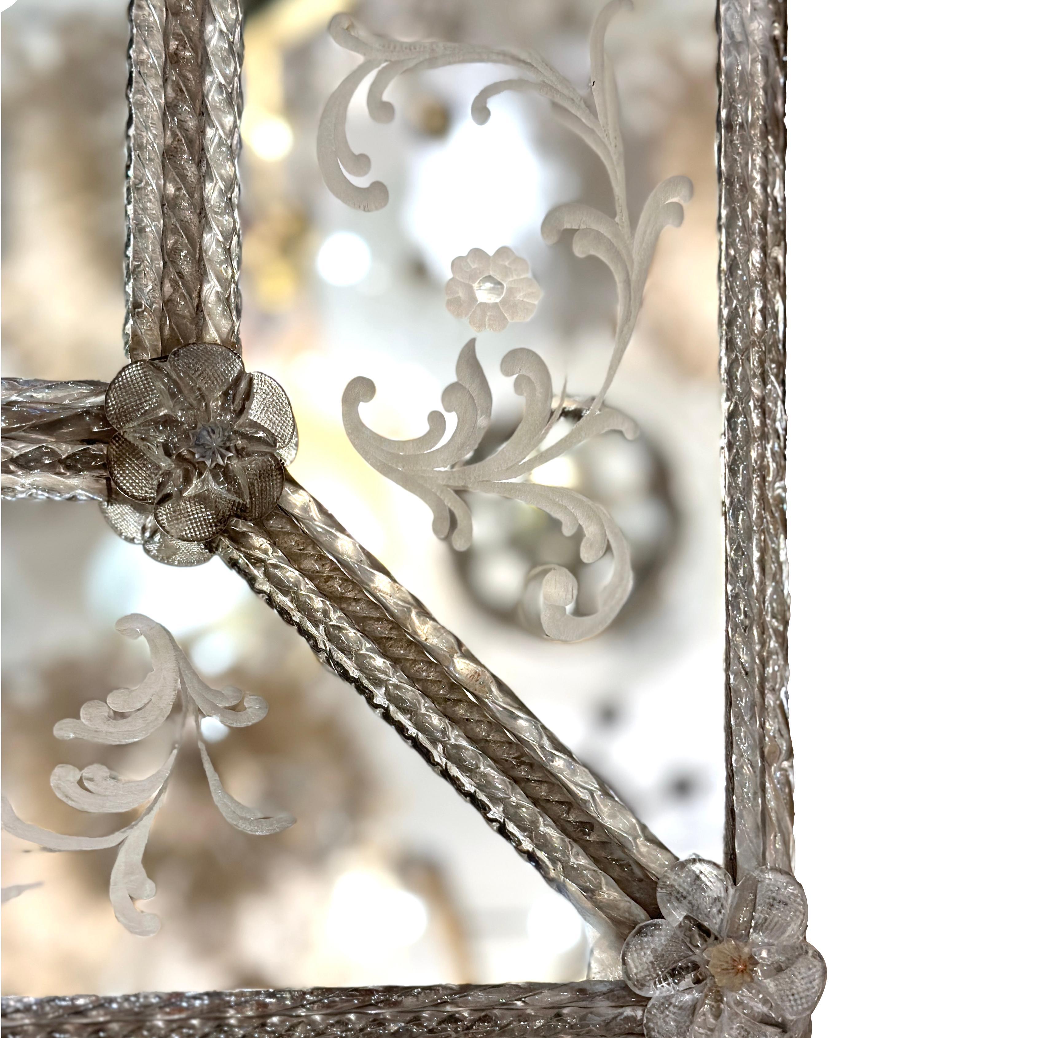 A circa 1900 Italian etched mirror with blown glass decorative elements.

Measurements:
Height: 51