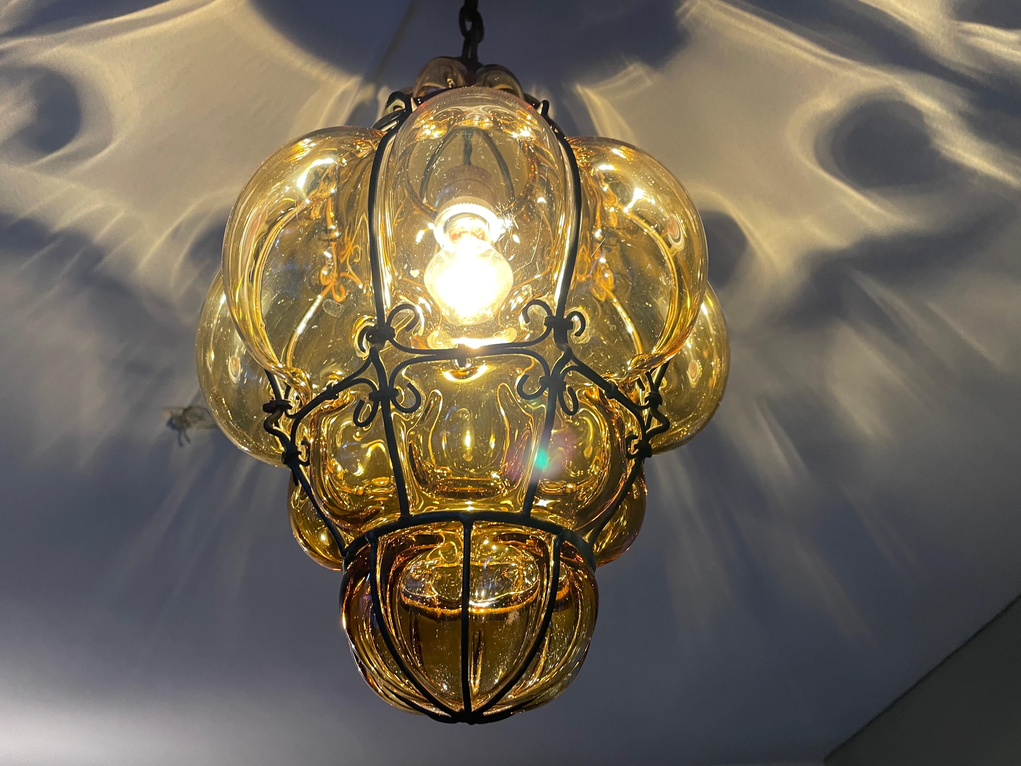 Superb condition and great color antique Murano pendant.

If you are looking for a truly handcrafted and stylish fixture to grace your living space then this antique Venetian specimen could be perfect. With early 20th century lighting as one of our