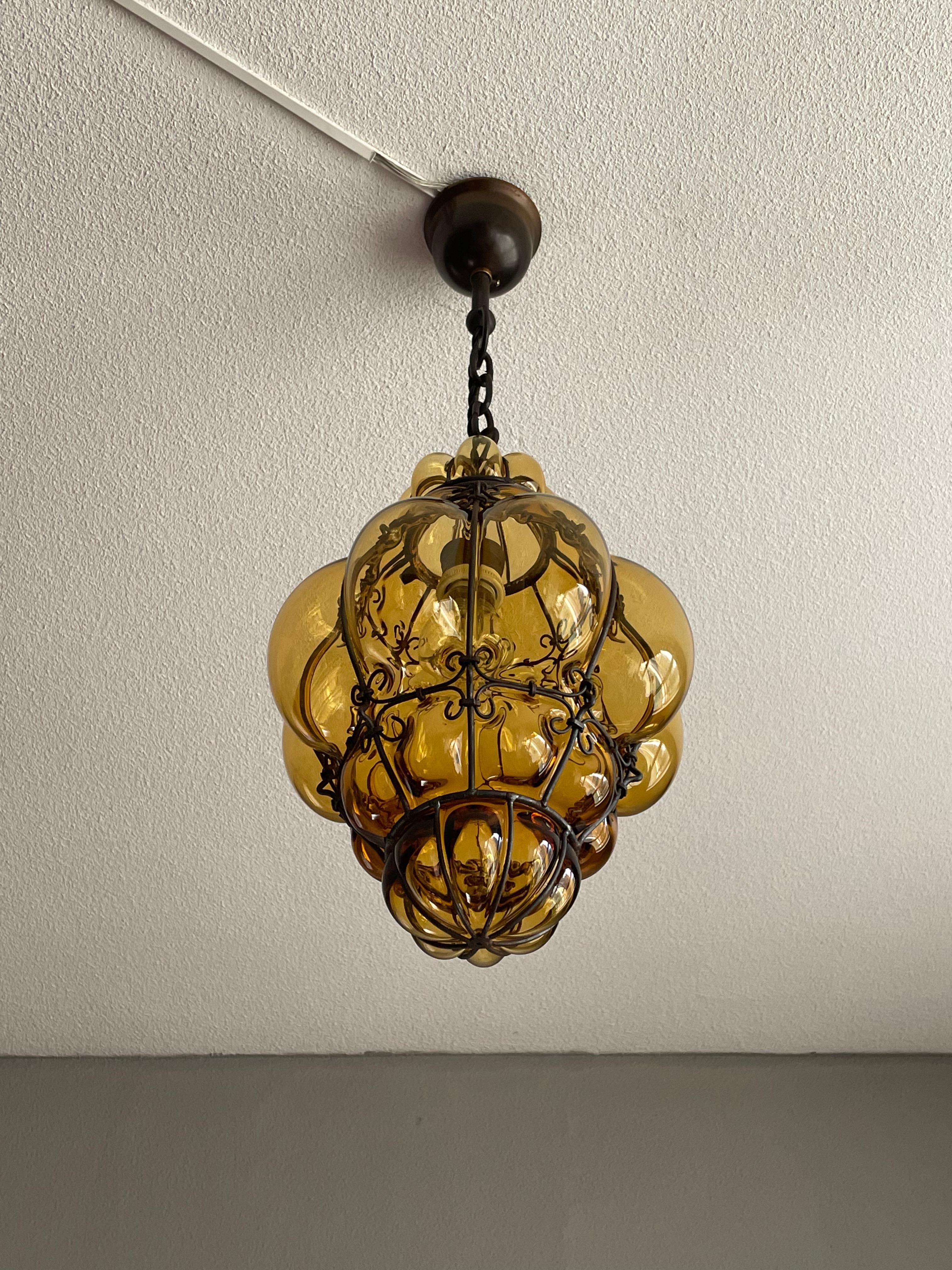 Arts and Crafts Antique Venetian Murano Pendant Light Mouthblown Glass into a Wrought Iron Frame For Sale