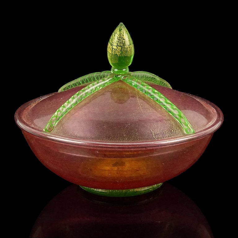 Beautiful, antique, early Venetian / Murano hand blown pink, green and gold flecks Italian art glass covered jar, jewelry box. Created in the manner of the Salviati and Fratelli Toso companies. The piece has a ton of little pink dots that create the