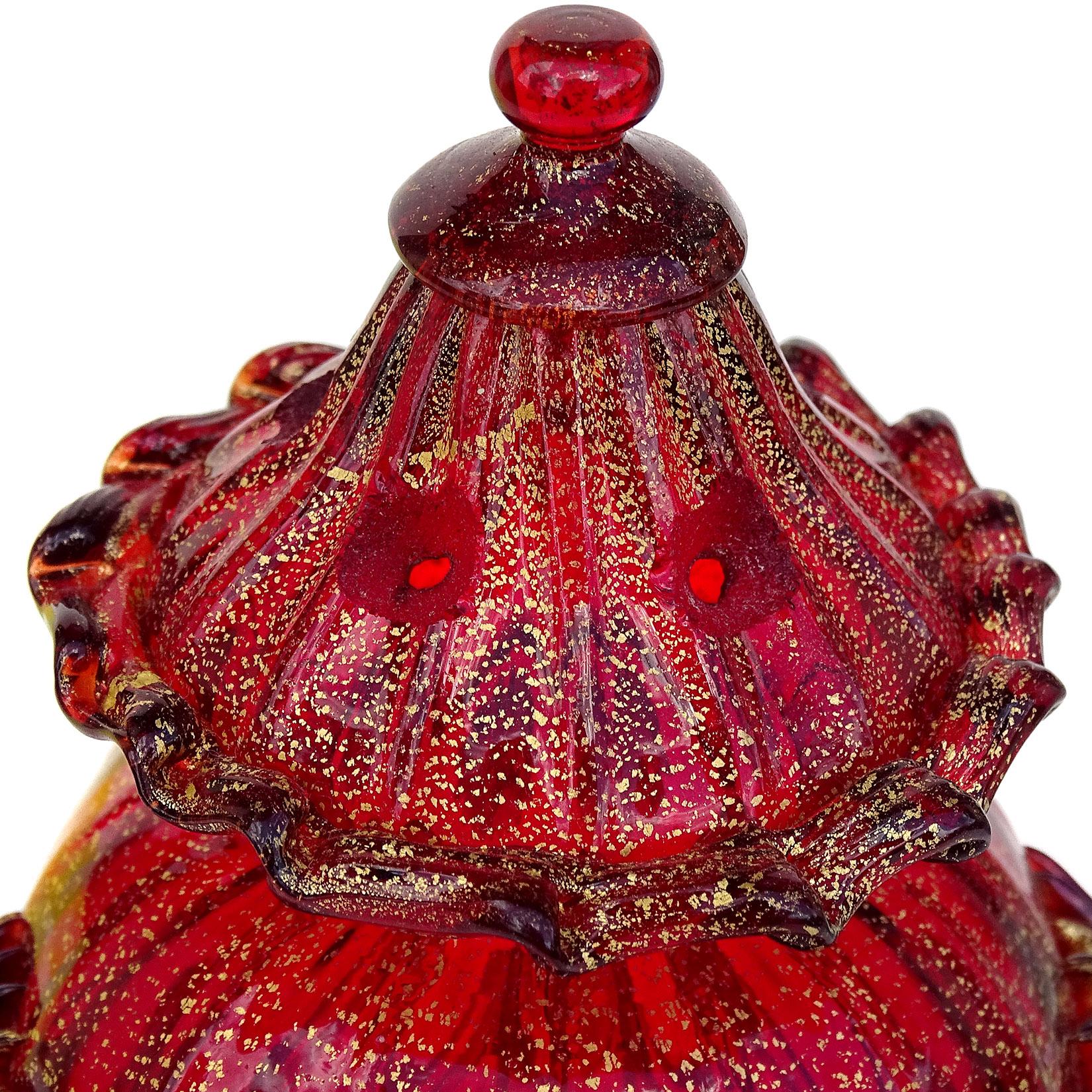 Beautiful, antique Venetian hand blown ruby red and gold flecks Italian art glass decorative table item. Created in the manner of the Salviati company. The piece looks to be a very large salt shaker or maybe an incense holder in the shape of a jar.