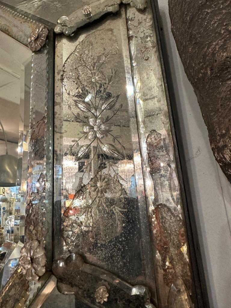 Antique Venitian Extended Octaglonal Eglomise floral mirror with chain etched beveling. Side panels hold Glass Floral design as well as a eglomise style art work underneath the side panels.