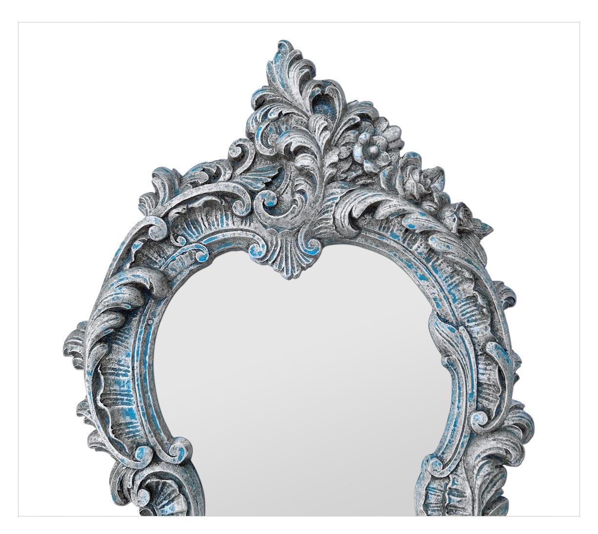 Rare Venetian-style patinated silvered mirror in the shape of an escutcheon. Moulded terra cotta frame from the 1950s, stamped 