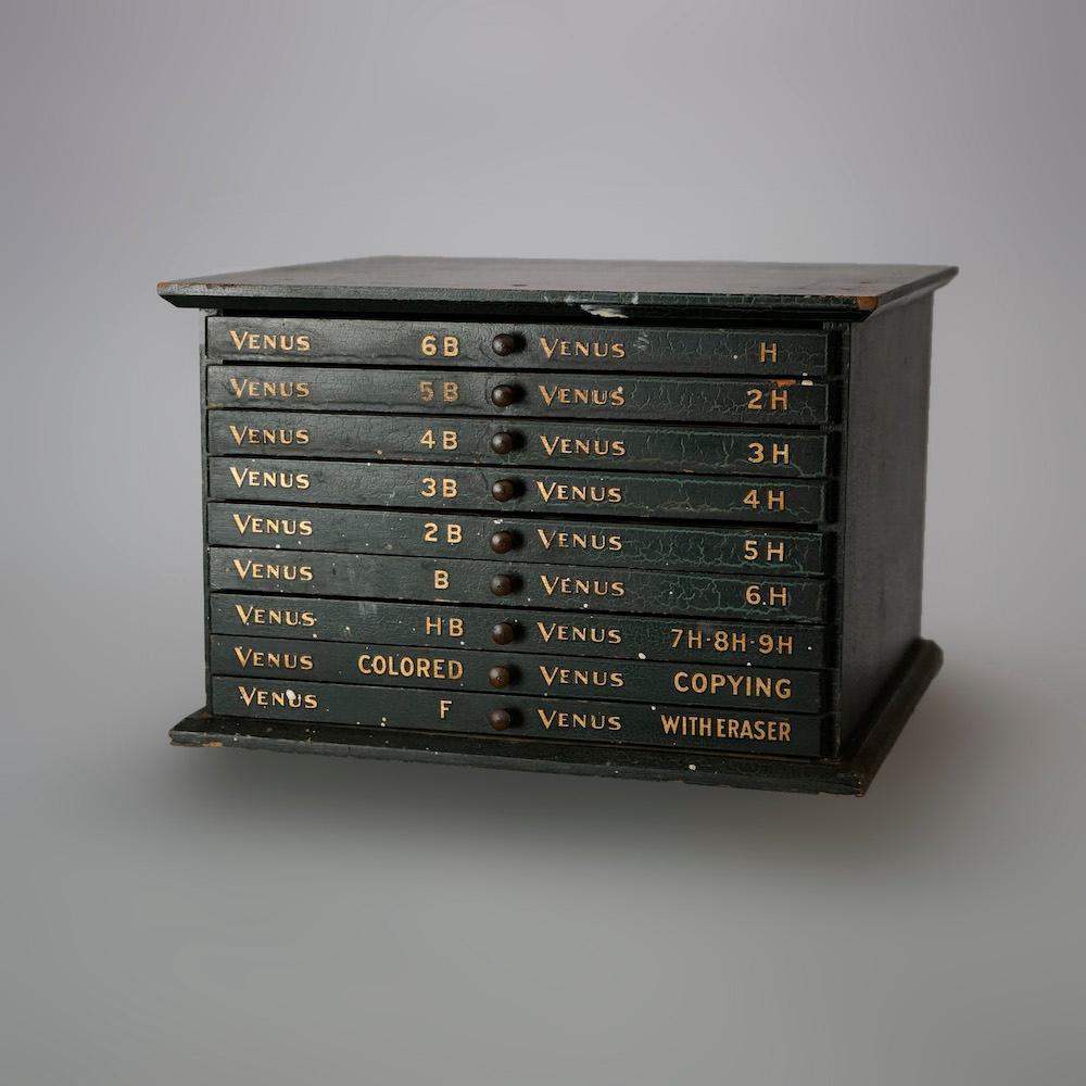 An antique Venus advertising pencil box offers narrow drawers with gilt lettering, c1920

Measures- 6.75''H x 10.25''W x 9.25''D