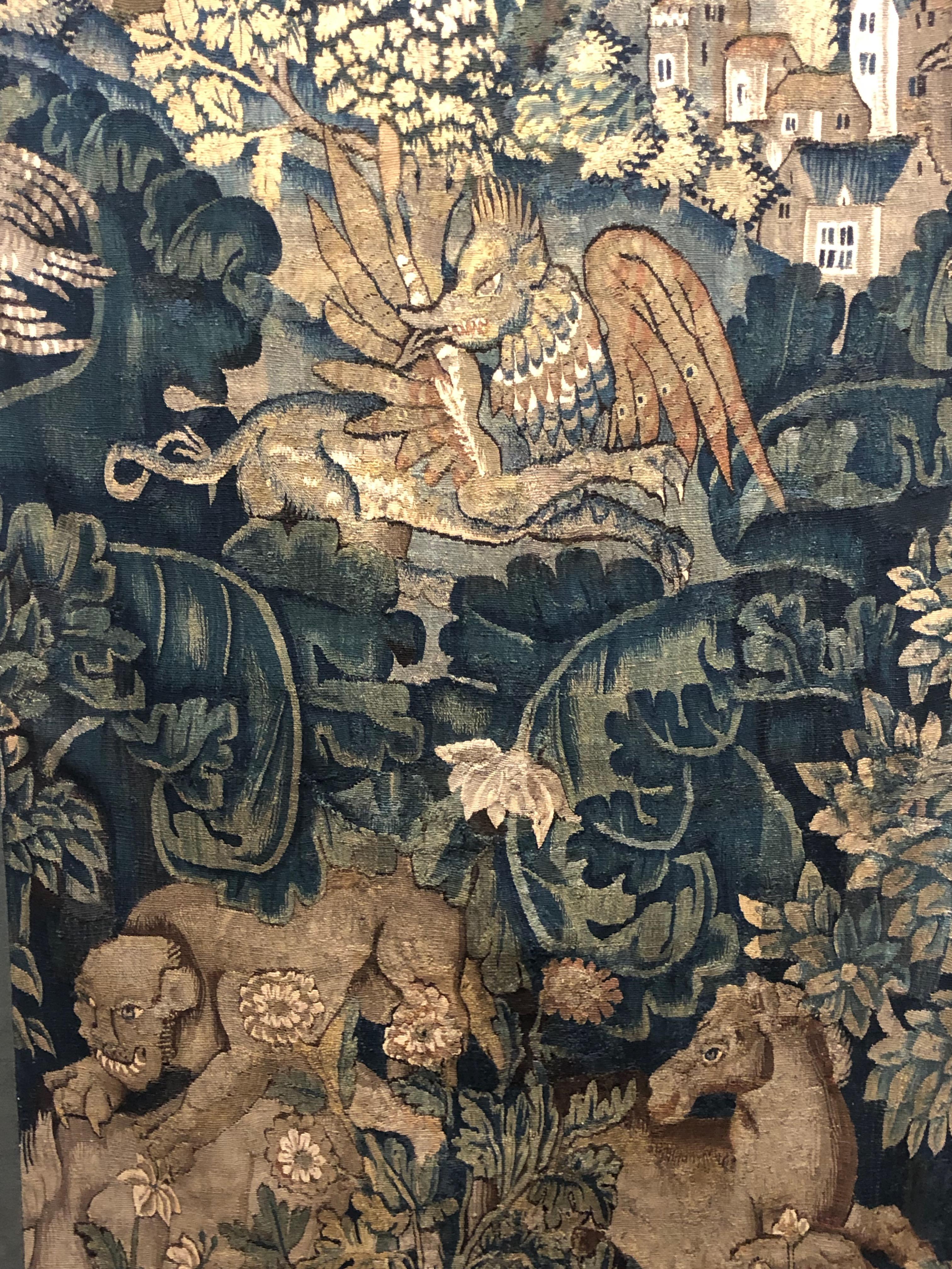 16th century Flemish Verdure Feuilles de Choux tapestry panel. 
Feuilles de Choux (trans. cabbage leaves) tapestry include large leaves in an overall, often wild motif with animals of the hunt or exotic creatures admired for their beauty and