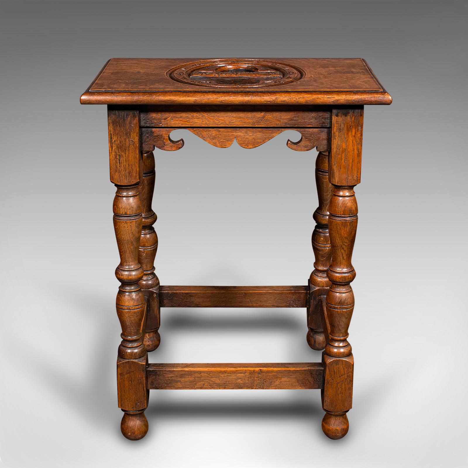 This is an antique verger's stool. An English, oak side or hall stool with ecclesiastical taste, dating to the late Victorian period, circa 1900.

Pleasingly petite and with a delightful carved appearance
Displays a desirable aged patina and in very