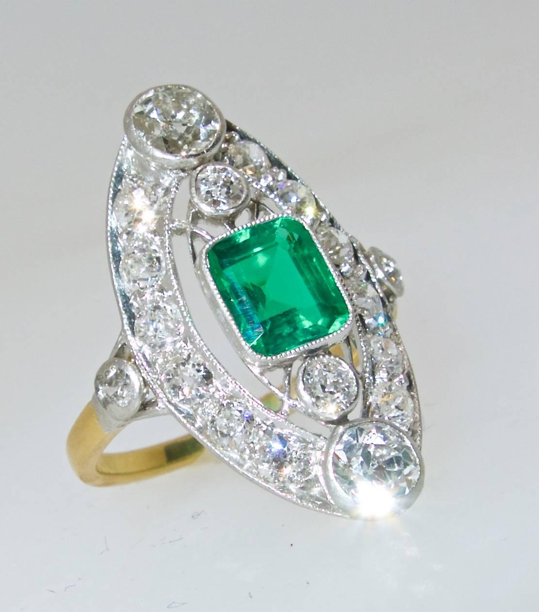  Platinum ring possessing a superb .91 ct. Colombian emerald with an AGL certificate stating treatment as:  None!  In todays market this is extremely rare.  The 18 old cut diamonds weigh approximately .91 cts.  This Belle Epoche ring is both 18K