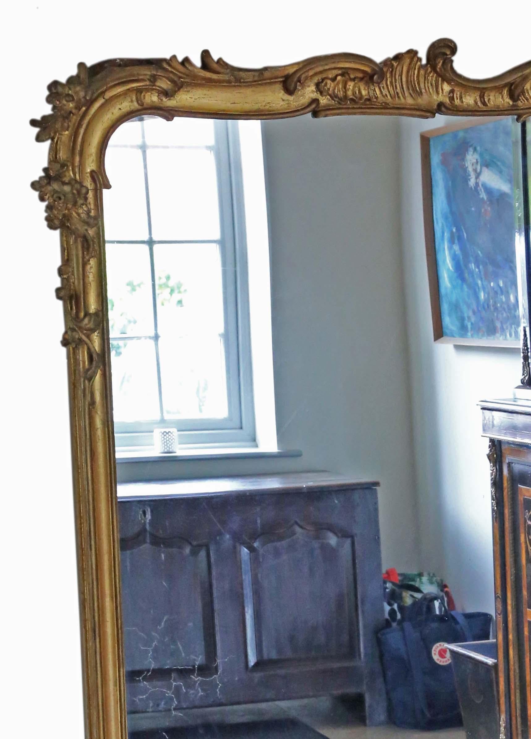 Antique Very Large 19th Century Gilt Floor Overmantle Wall Mirror - High-Quality Piece. Lovely charm and elegance.

This is a rare, large, and imposing mirror. A bit different and quite special.

An impressive find that would look amazing in the