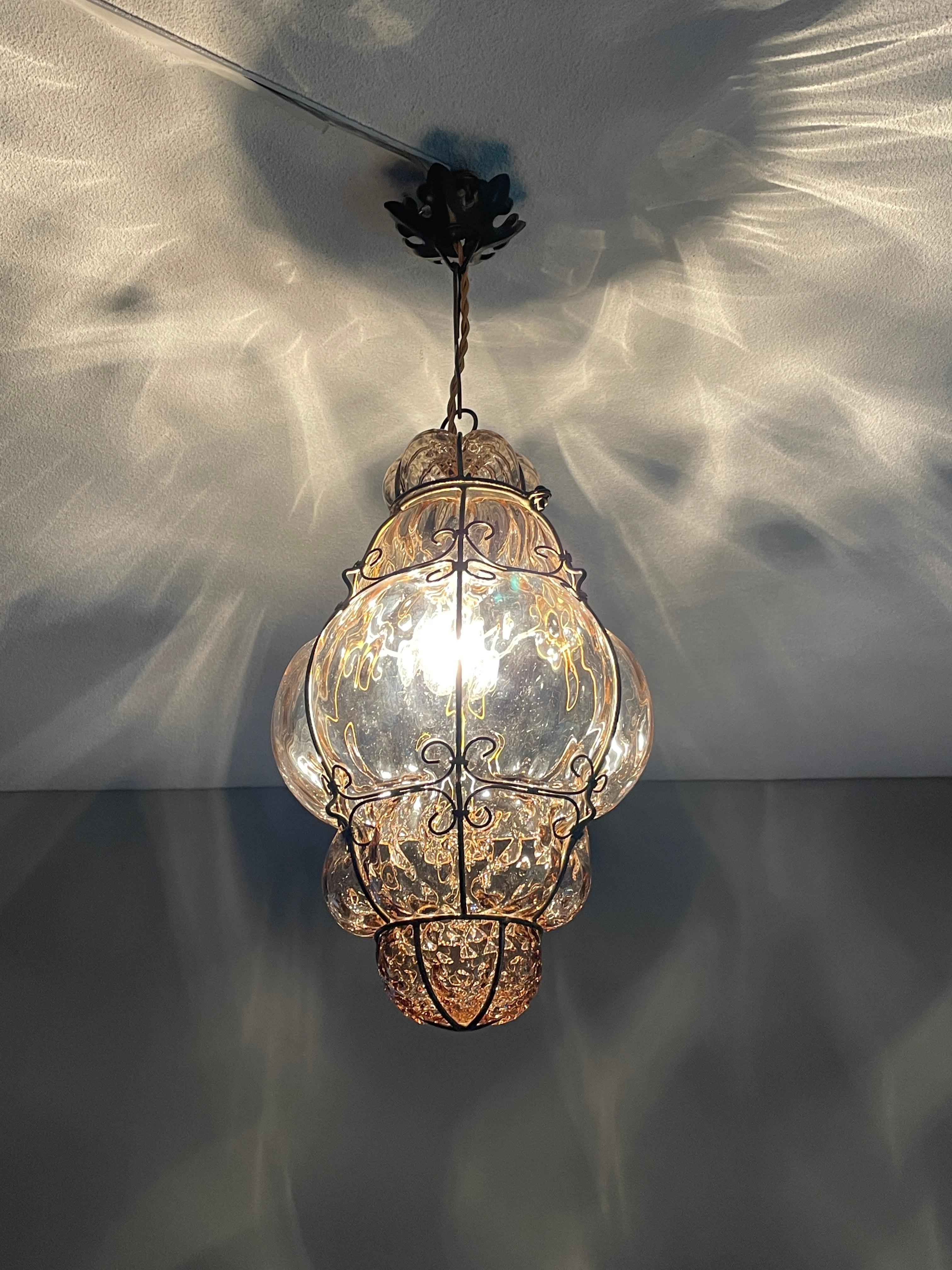 Practical size & brilliant Venetian pendant. Perfect smokey amber glass in rare brass frame.

This early Venetian pendant light is one of the most handsome that we ever had the pleasure of offering. When it comes to condition, style, materials and