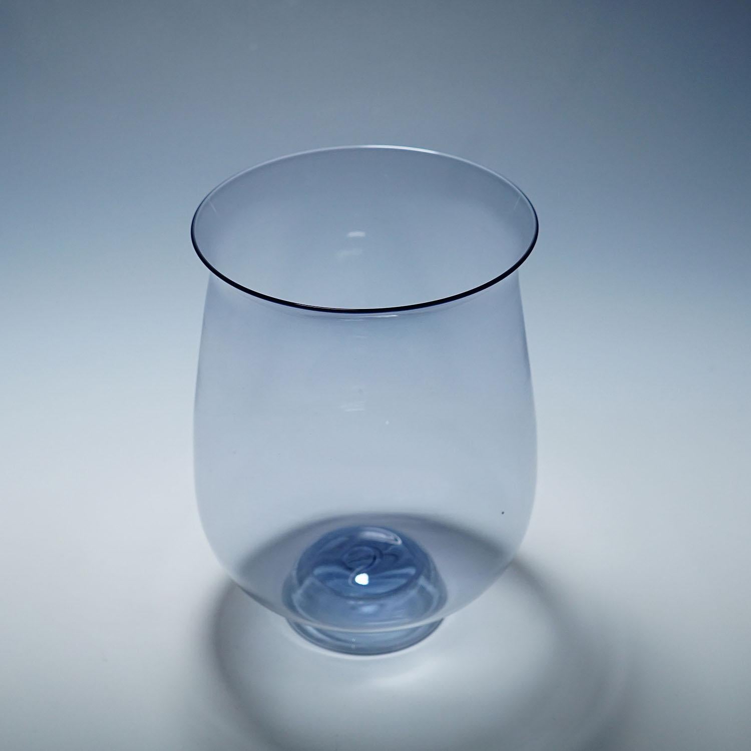 Antique Vetro Soffiato Glass Vase, Murano 1920s

Beautiful 'Vetro Soffiato' vase with bell-shaped bowl and conical foot made of very thin, light blue, transparent glass. Made by Cirillo Maschio, Venini or Cappelin Murano Venice in the late 1920s.