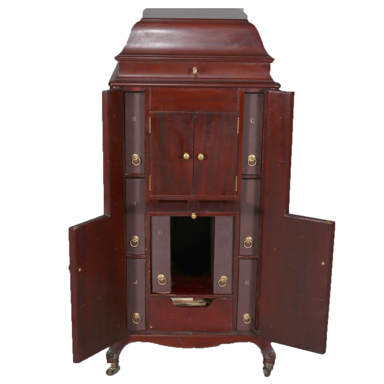 An antique Victorian floor model Victor Victrola phonograph by Victor Talking Machine Co. Camden, NJ, Model VV-XVI 16584 B, features oak case with cabinets opening to interior record storage, original labels as photographed, circa 1930.

Measures: