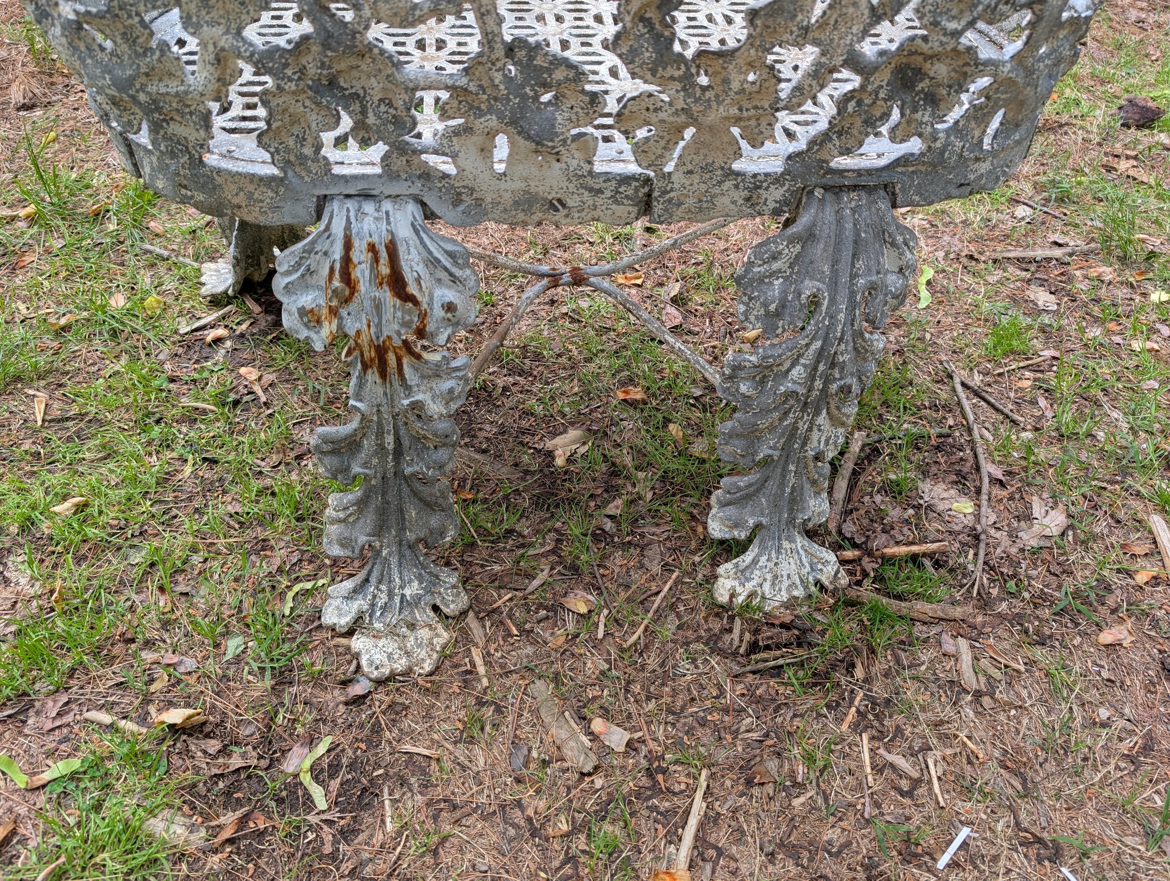 An Antique Victorian garden bench in cast iron with original weathered finish Measures 36