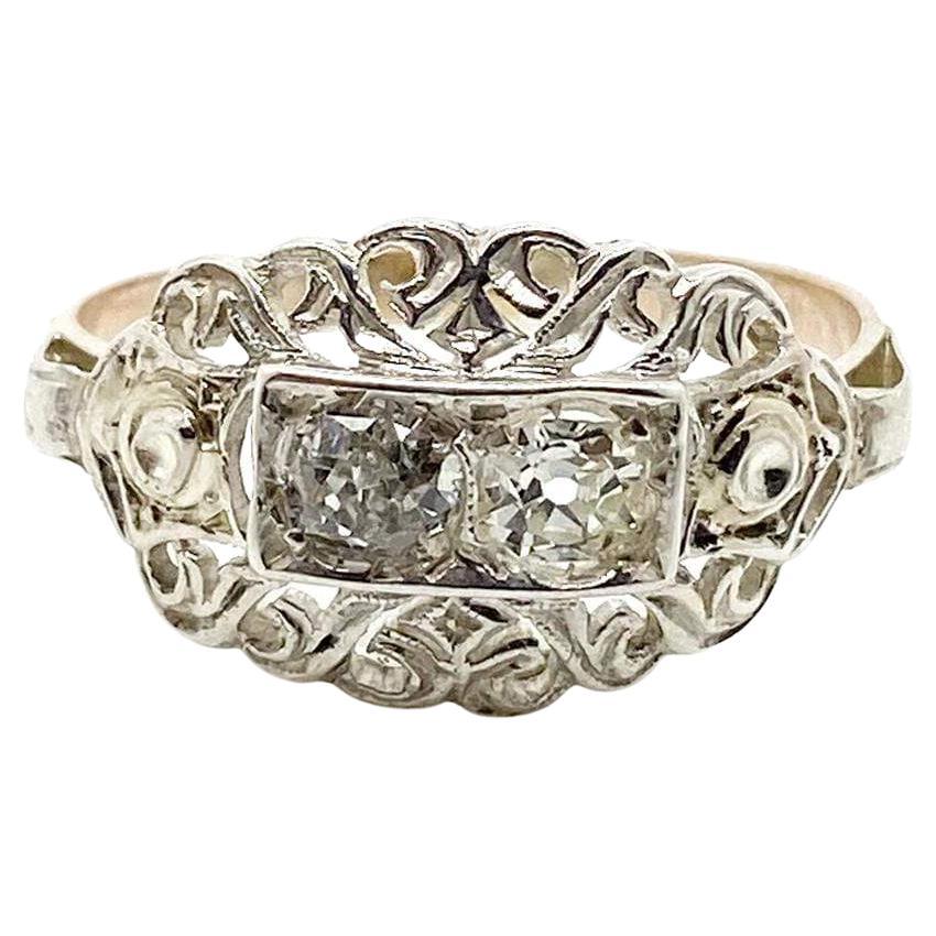 This timeless antique Victorian ring is crafted from 14ct yellow and white gold, featuring a unique ornate design with 0.70ct of Old European and Old Mine cut diamonds. With its antique style and orante craftsmanship, this ring is sure to become a