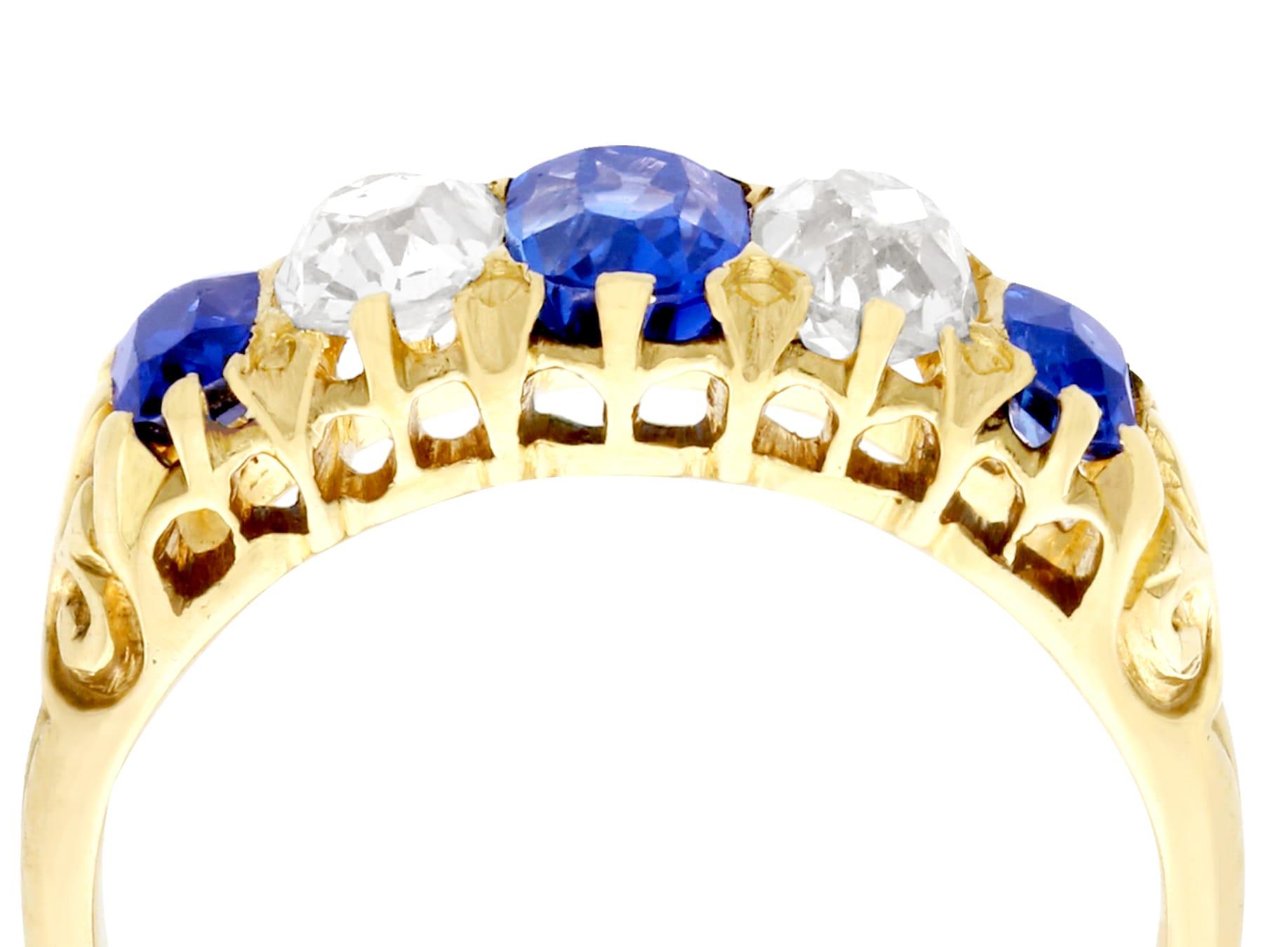 A stunning, fine and impressive 1.05 carat blue sapphire and 0.67 carat diamond, 18 karat yellow gold five stone / dress ring; part of our diverse antique jewelry and estate jewelry collections.

This stunning, fine and impressive Victorian oval cut