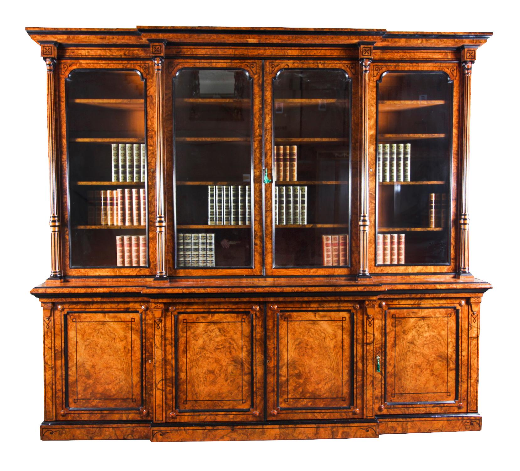 A superb antique English Victorian top quality burr walnut and ebonised four door breakfront library bookcase, attributed to Lamb of Manchester,  Circa 1850 in date.

This magnificent bookcase is made from the highest quality burr walnut with