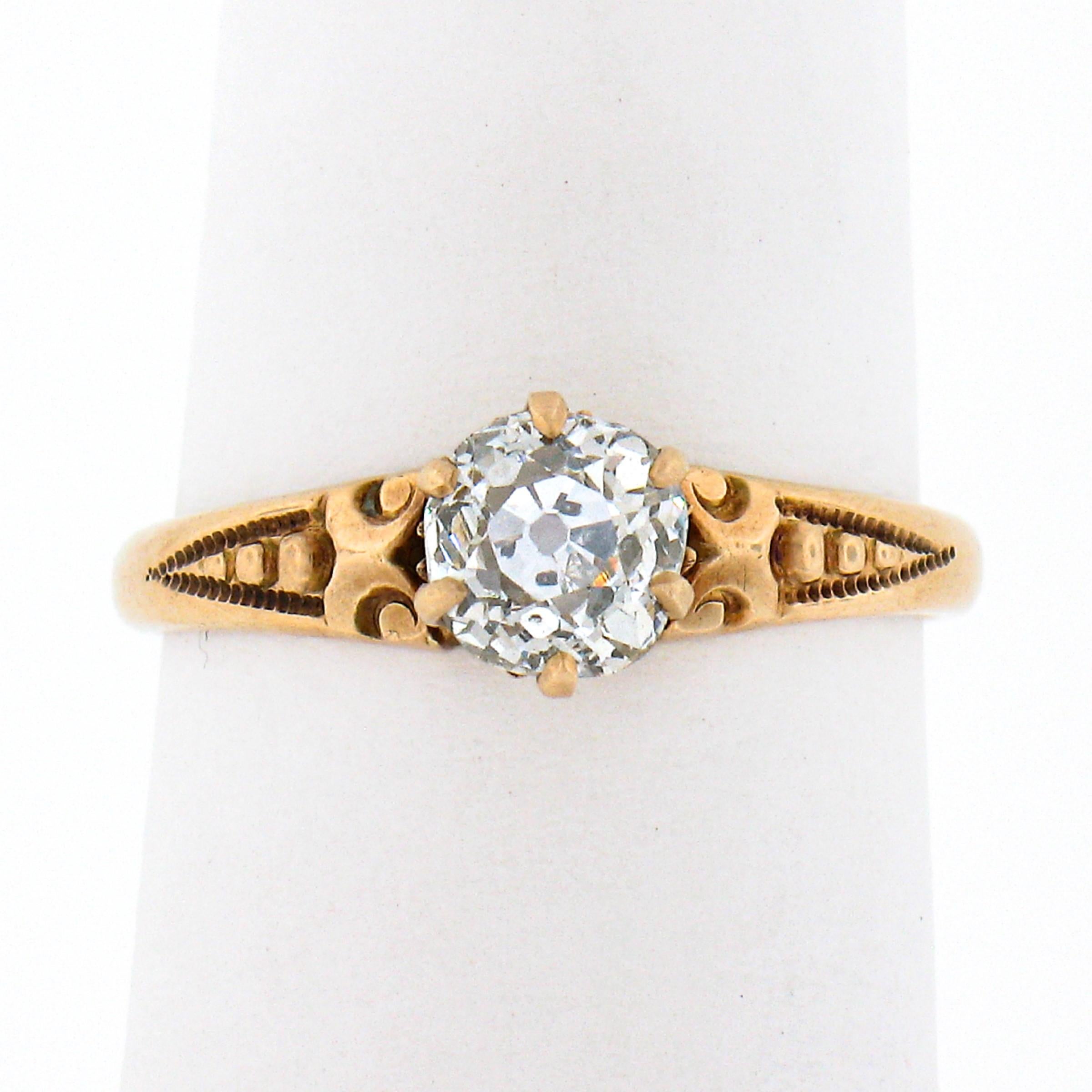 This gorgeous antique diamond engagement ring was crafted from 10k gold during the Victorian era and features a fine quality old mine cut diamond solitaire neatly prong set at its center. This stunning diamond has been certified by GIA at exactly