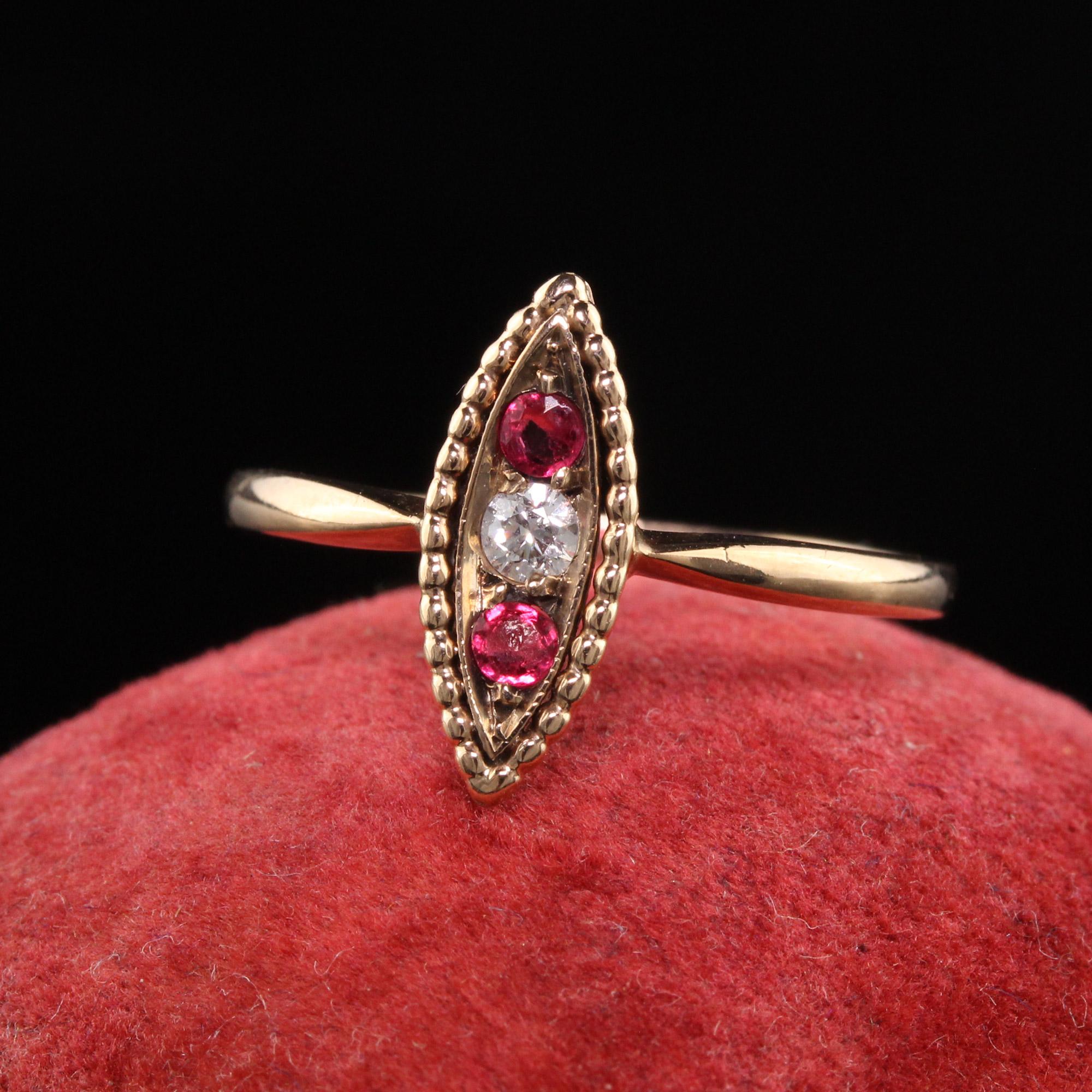 Beautiful Antique Victorian 10K Rose Gold Diamond and Ruby Navette Ring. This pretty dainty ring has a white diamond in the center with a ruby on top and below it. The sides have beautiful filigree work and is in great condition.

Item