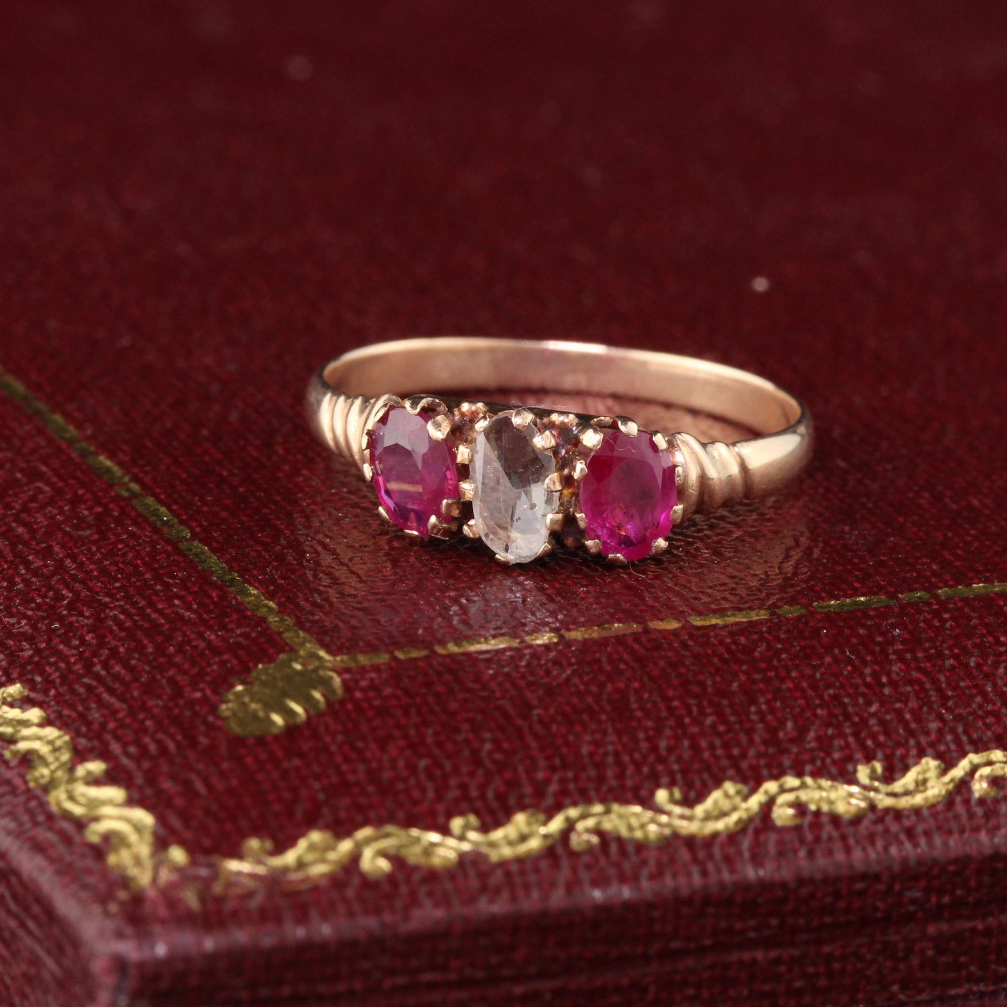 Victorian 3-Stone Engagement Ring with a rose cut oval diamond in the center and oval rubies on either side!

#R0331

Metal: 10K Rose Gold 

Weight: 1.4 Grams

Diamond Weight: Approximately 0.20 cts

Diamond Color: J

Diamond Clarity: SI2

Ring