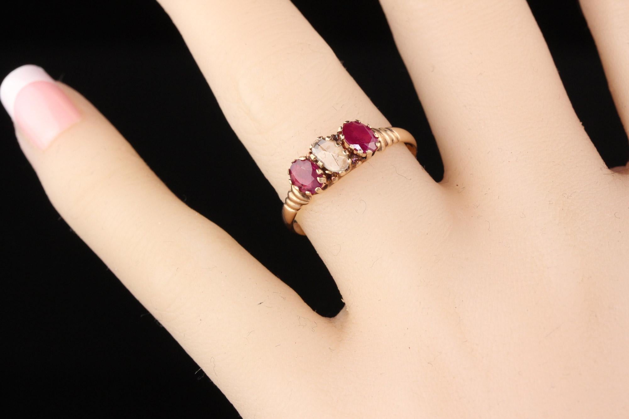 Oval Cut Antique Victorian 10 Karat Rose Gold Rose Cut Diamond and Ruby 3-Stone Ring For Sale