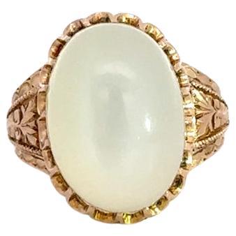 Antique Victorian 10k Rosy Yellow Gold Oval Cabochon Moonstone Engraved Ring For Sale