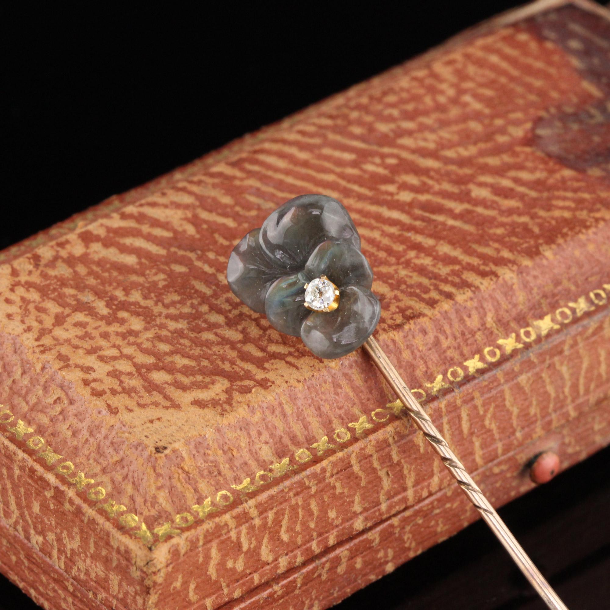 Victorian Stick Pin with a carved labradorite pansy with a diamond in the center.

Metal: 10K Yellow Gold

Weight: 2.4 Grams

Diamond Weight: Approximately 0.07 ct old mine cut diamond

Measurements: Head measures 14.97 x 12.62 mm
