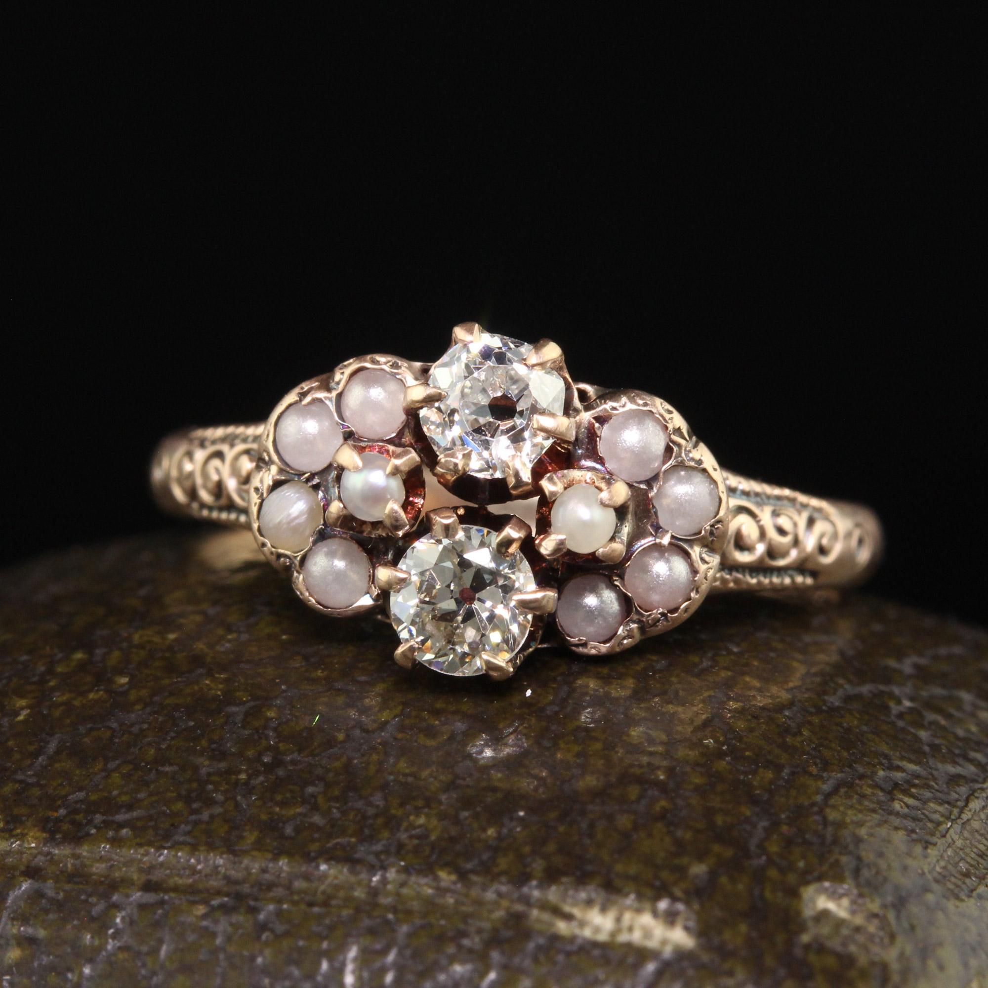 Beautiful Antique Victorian 10K Yellow Gold Old Euro Diamond and Pearl Toi et Moi Ring. This beautiful Toi et Moi ring is crafted in 10k yellow gold. The center holds two old European cut diamonds and they are surrounded by natural seed pearls on