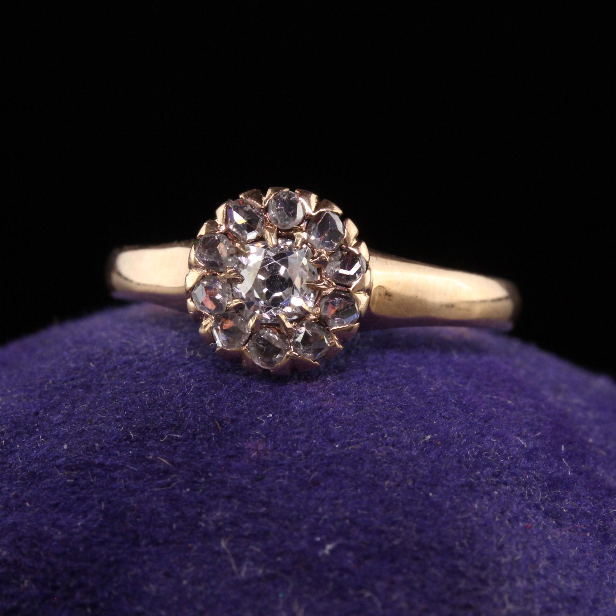 Beautiful Antique Victorian 10K Yellow Gold Old Mine Rose Cut Diamond Engagement Ring. This beautiful classic engagement ring is crafted in 10k yellow gold. The ring holds an old mine cut diamond in the center and is surrounded by rose cut diamonds.