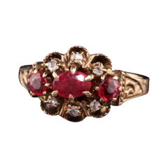 Antique Victorian 12K Rose Gold Ruby and Diamond Three Stone Ring