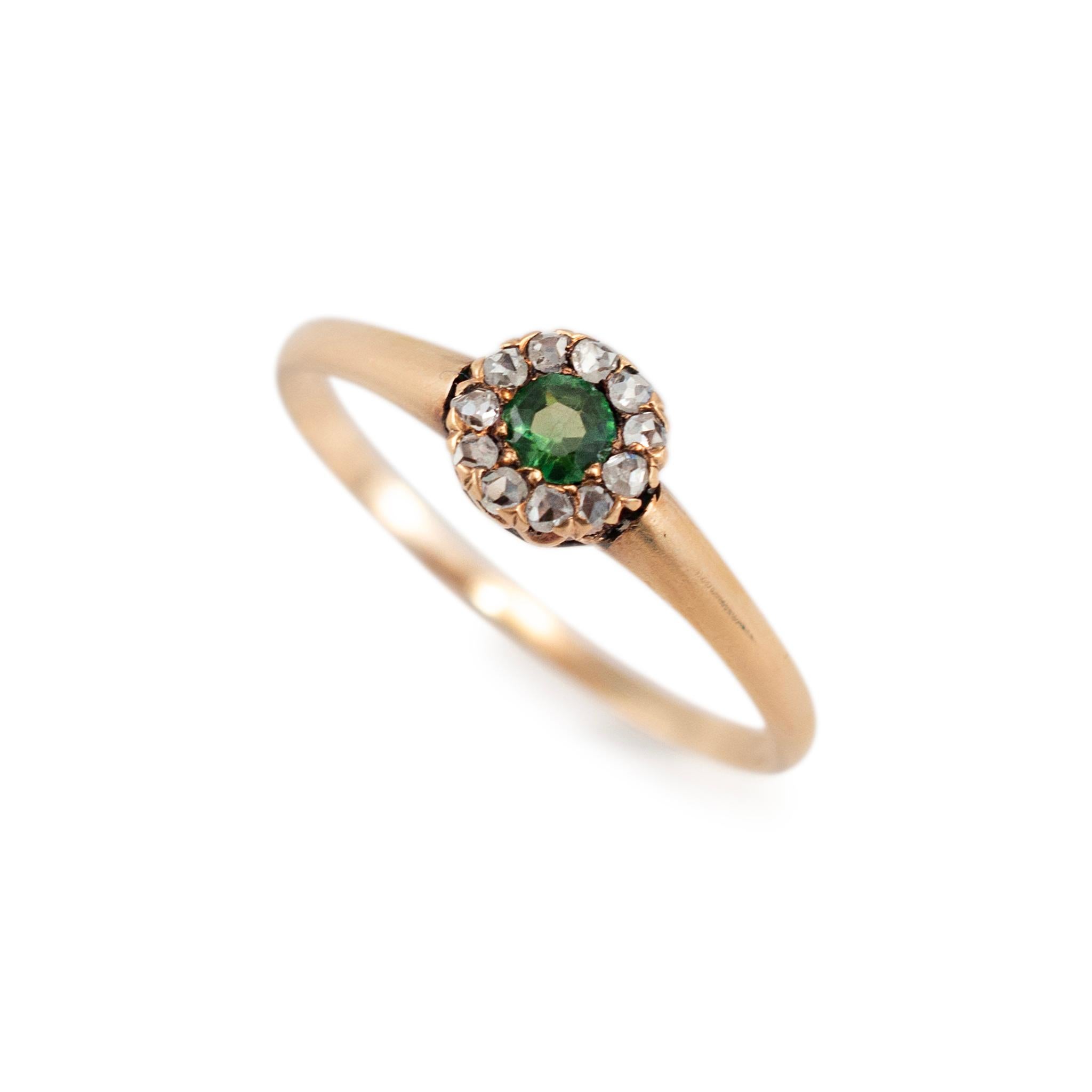 Gender: Ladies

Metal Type: 12K Yellow Gold

Ring Size: 8

Width: 5.85 mm tapering to 1.25 mm

Weight: 1.33 grams

One ladies satin-finished textured 12K yellow gold Victorian (1837-1901) diamond and tourmaline halo cocktail ring with a half-round