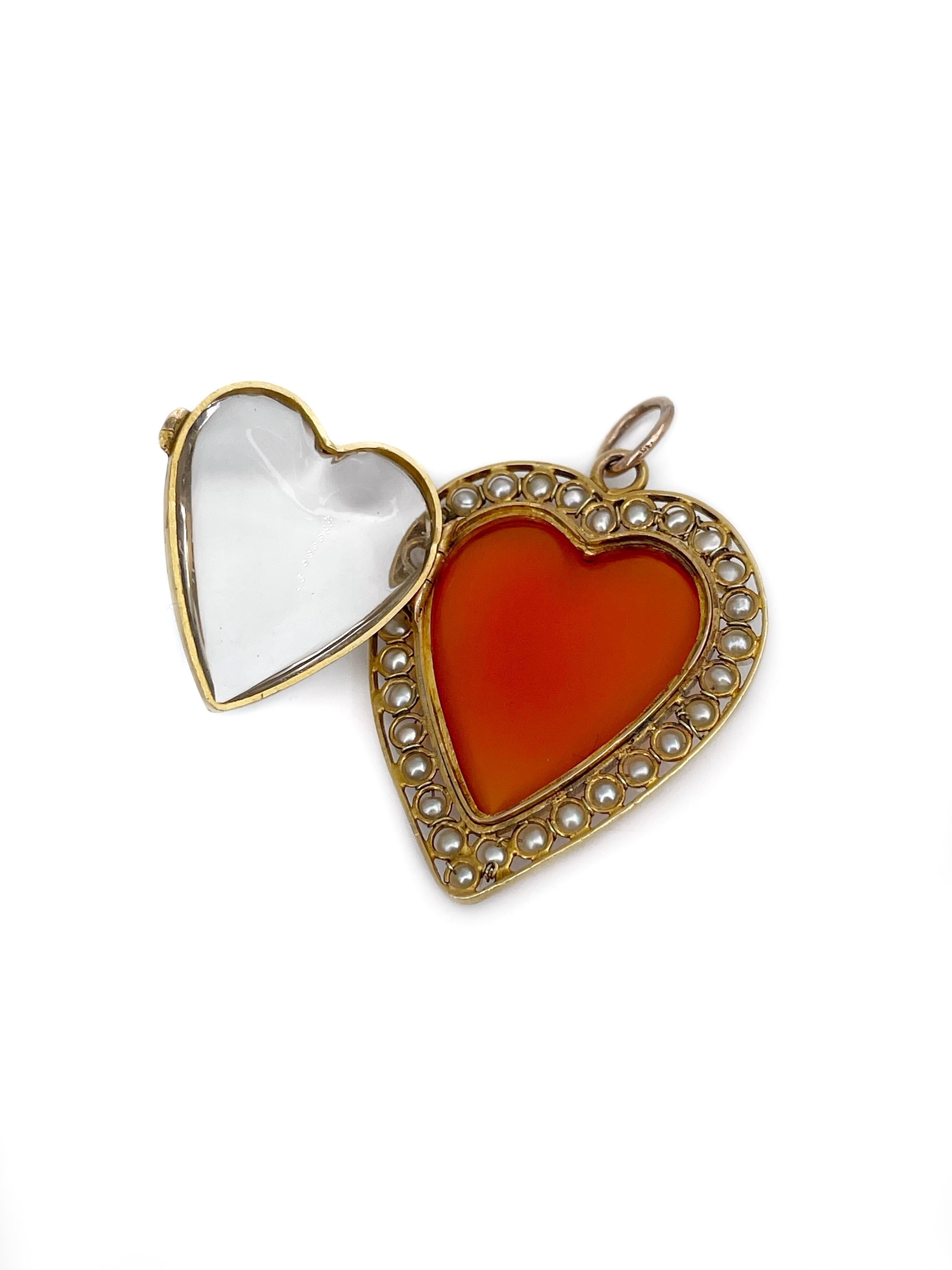 This is a magnificent Victorian heart locket pendant crafted in 14K yellow gold. The piece features cabochon cut carnelian and is adorned with 30 cultured pearls. It has a glass cover making a space for pictures. 

Weight: 5.17g
Size: