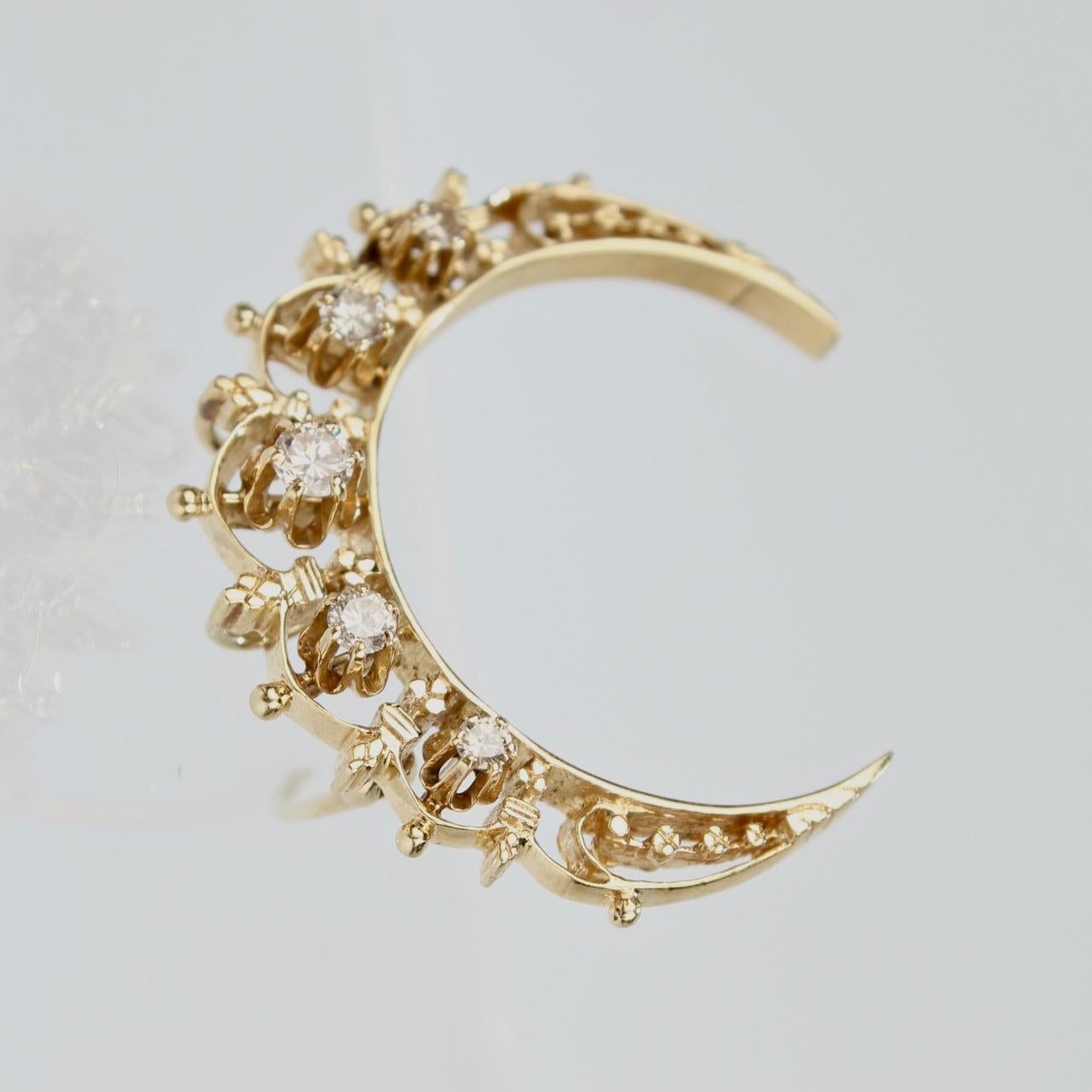 A beautifully crafted, antique 14k gold Victorian crescent moon-shaped convertible brooch and pendant.

Symbolically, the crescent moon is a harbinger of new things to come. Both waxing or waning, the crescent moon symbolizes Femininity, intuition,