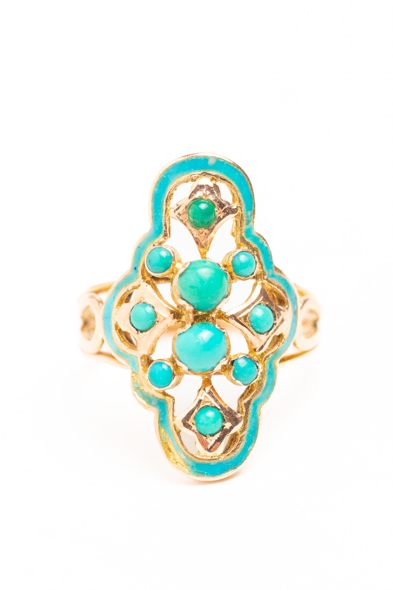 A beautiful and rare antique Victorian 14ct gold blue enamel and turquoise ring. The ring has an unusual open design and features ten turquoise cabochons crafted in 14ct yellow gold. The open design is created by the space between the central line