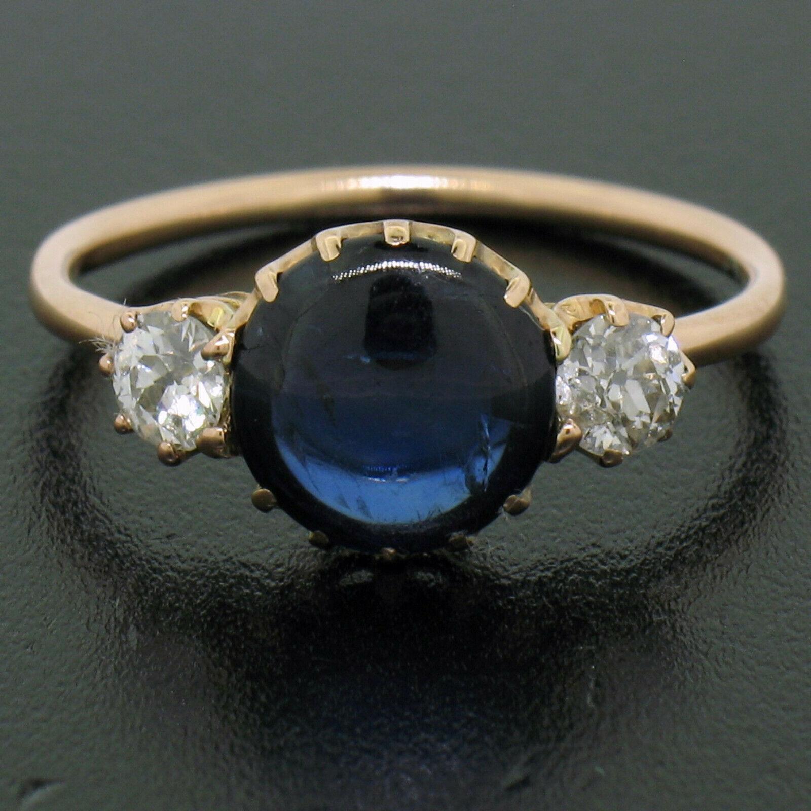 Here we have an absolutely adorable antique ring crafted in solid 14k rose gold during the Victorian period. The ring features an approximately 2.0 carat, round double cabochon cut, natural Burma sapphire at its center. The sapphire is a gorgeous,