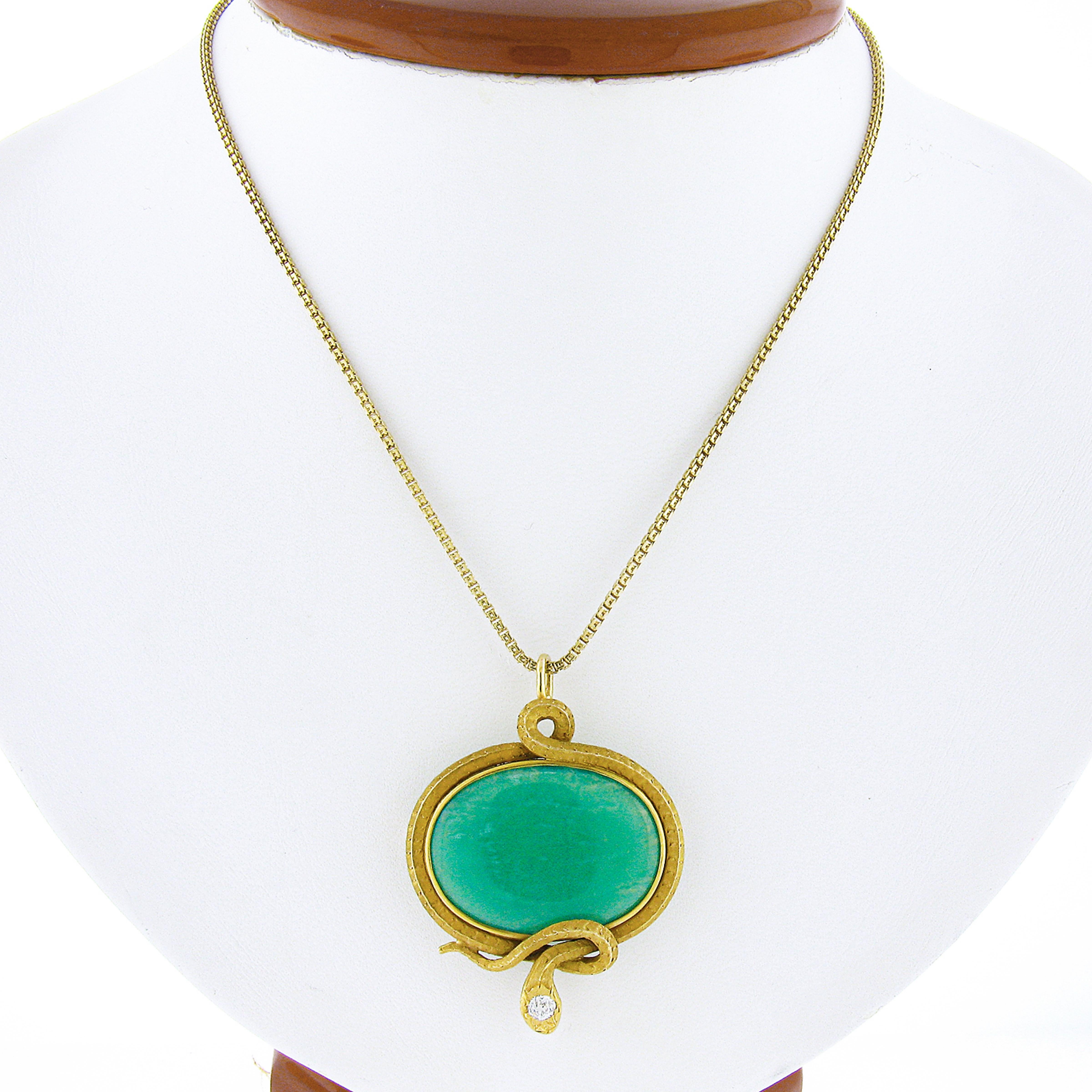 Here we have a gorgeous and very unique antique pendant/brooch that's crafted from solid 14k yellow gold. This outstanding piece features an oval cabochon cut natural chrysoprase stone neatly bezel set at the center of an incredibly detailed and