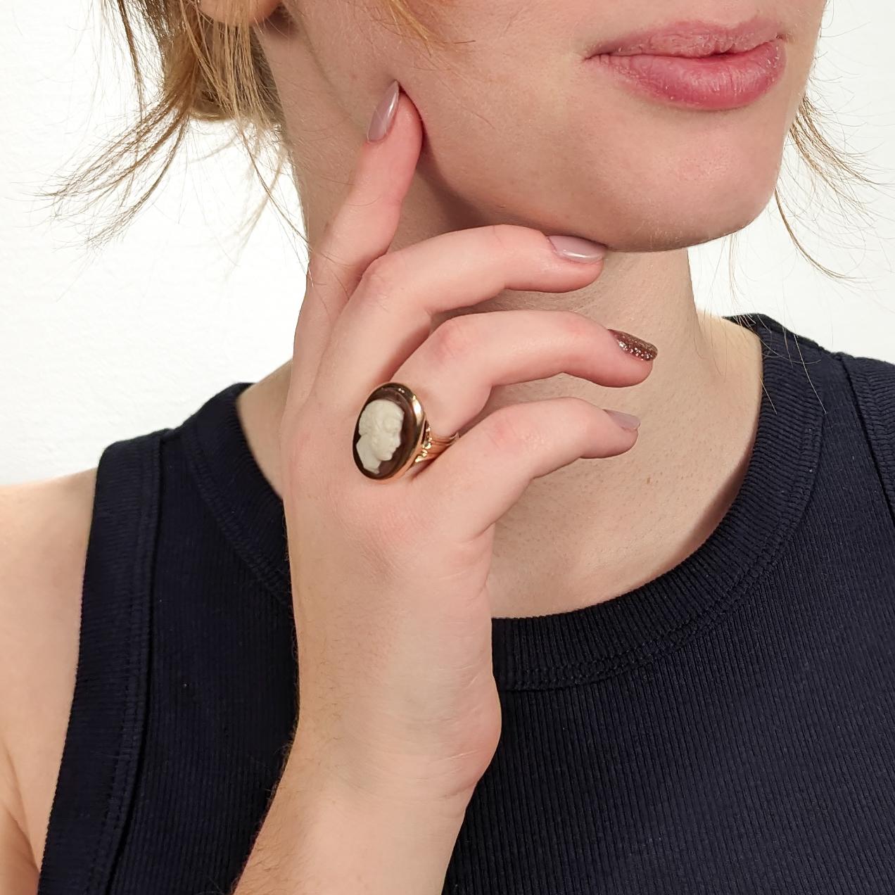 A fine antique Victorian ring.

In 14k gold.

With a carved agate cameo cabochon of a man in profile.

High set in a wide bezel setting with open work on a channeled band.

Simply a wonderful Victorian cameo signet ring!

Date:
19th Century

Overall