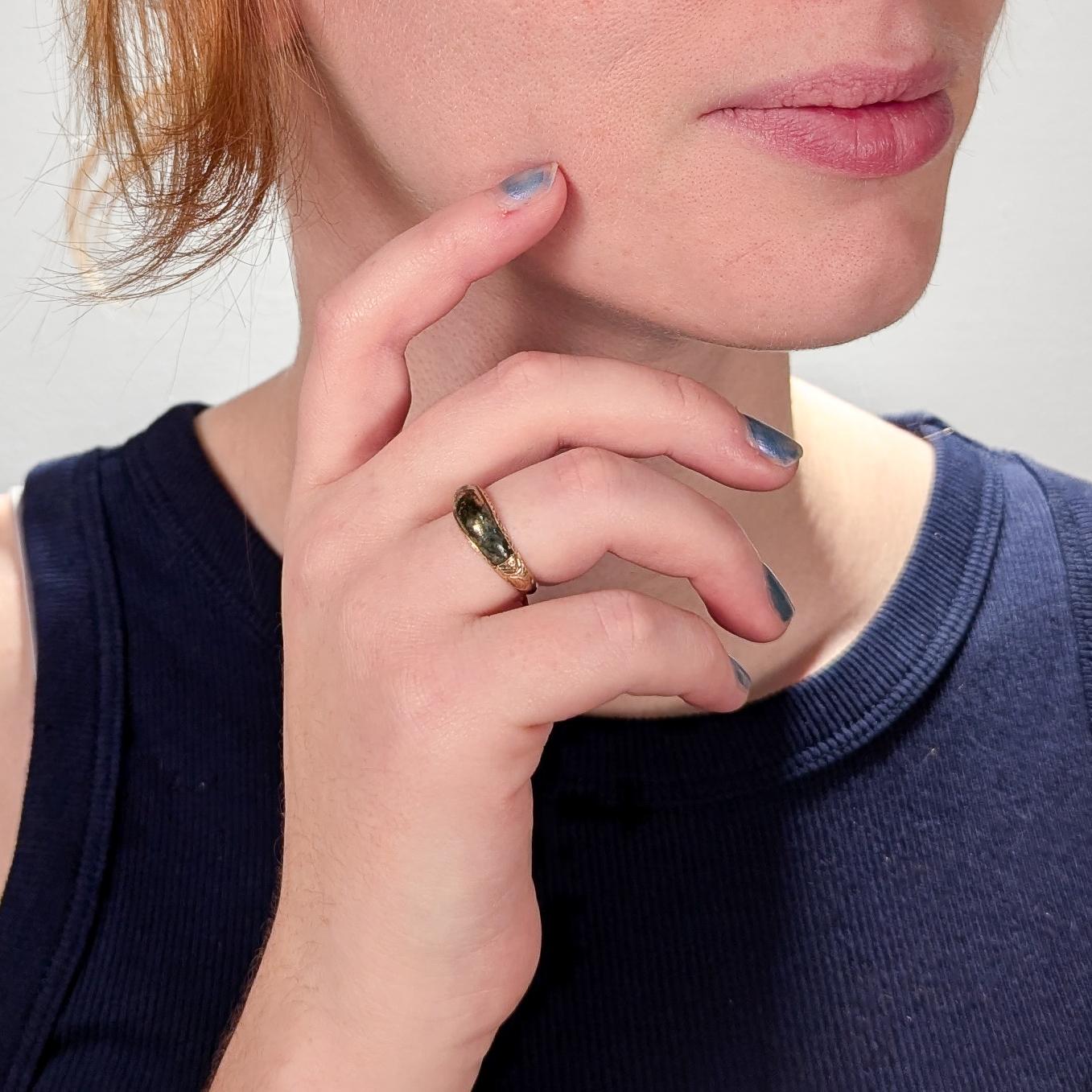 A fine antique Victorian ring.

In 14 karat yellow gold.

Inlaid with a polished, shaped pyrite (or gold quartz) cabochon and decorated with etched and engraved decoration to the sides & shoulders.

Simply a lovely pyrite specimen ring!

Date:
19th